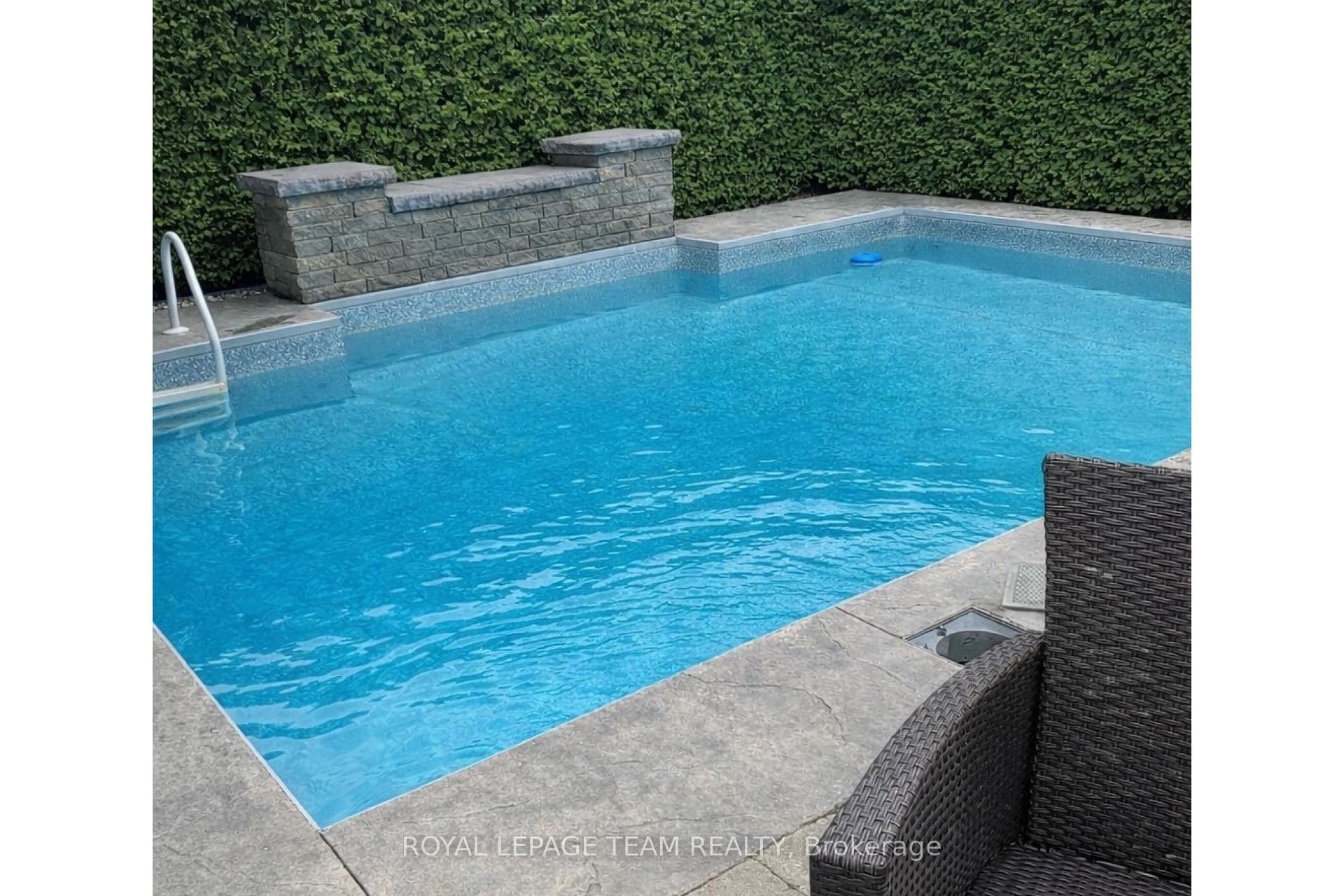 Heated salt water pool with waterfall feature