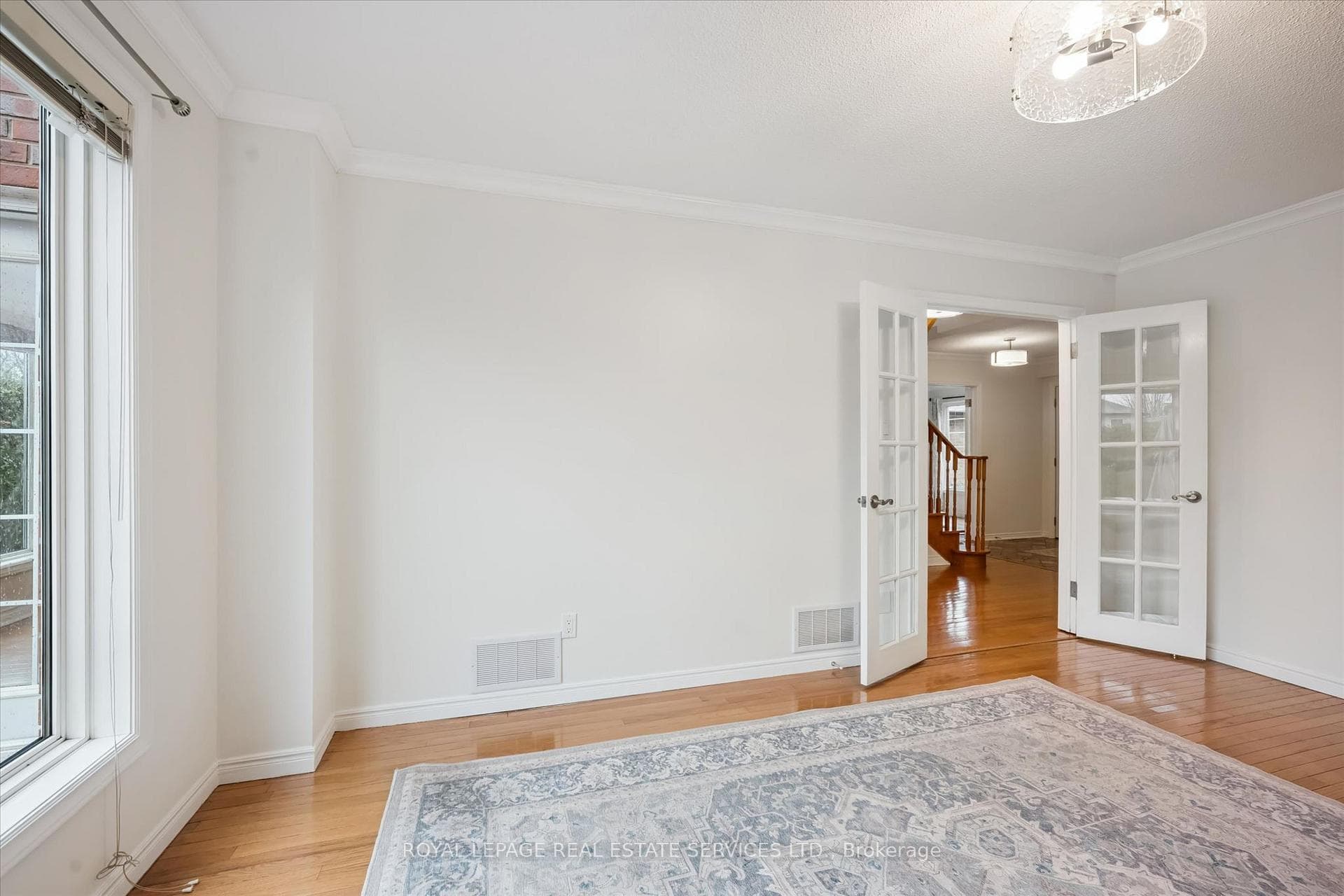 Family Room w/French Doors and Hardwood Flooring
