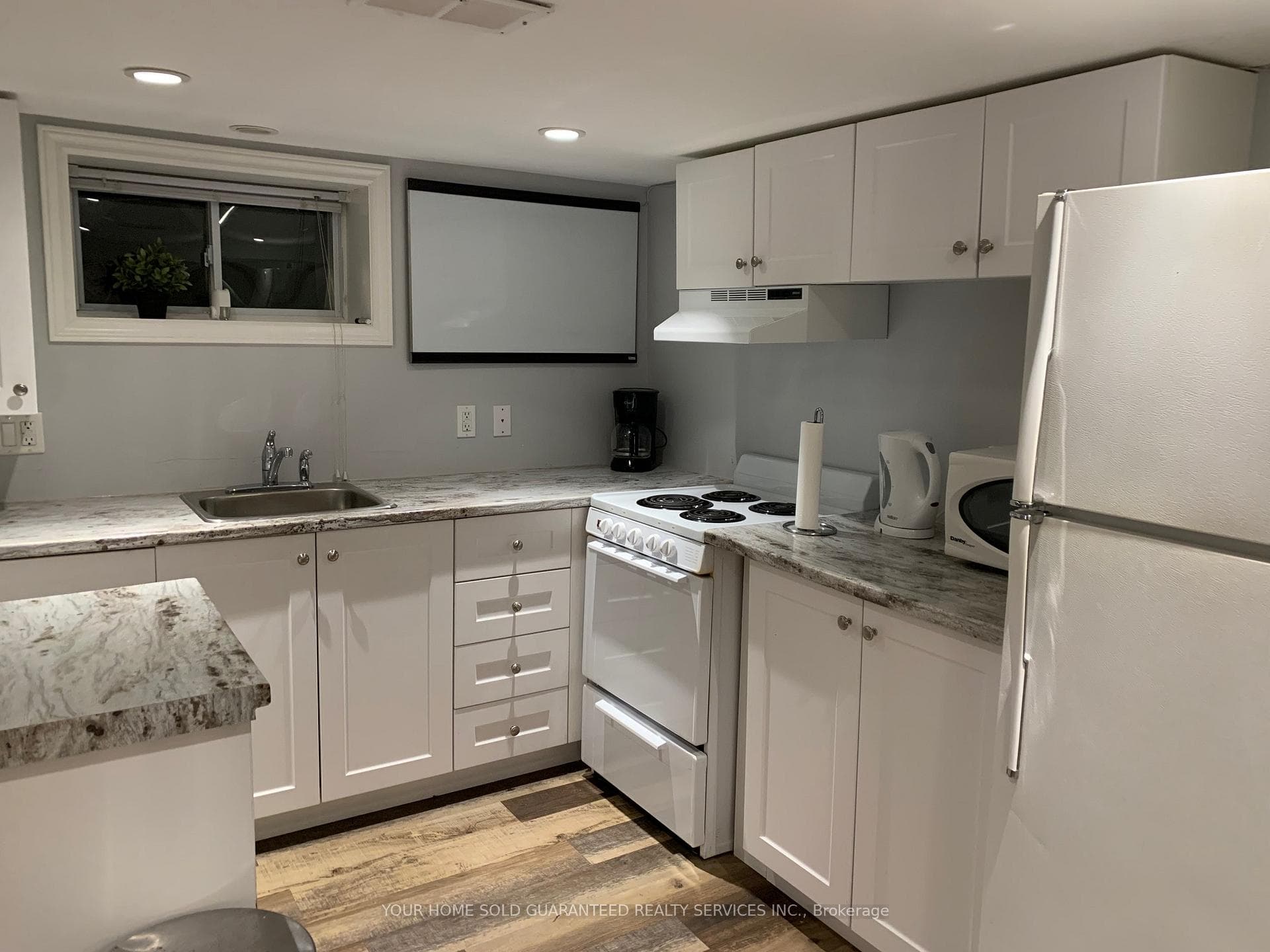 White Lower Level Kitchen