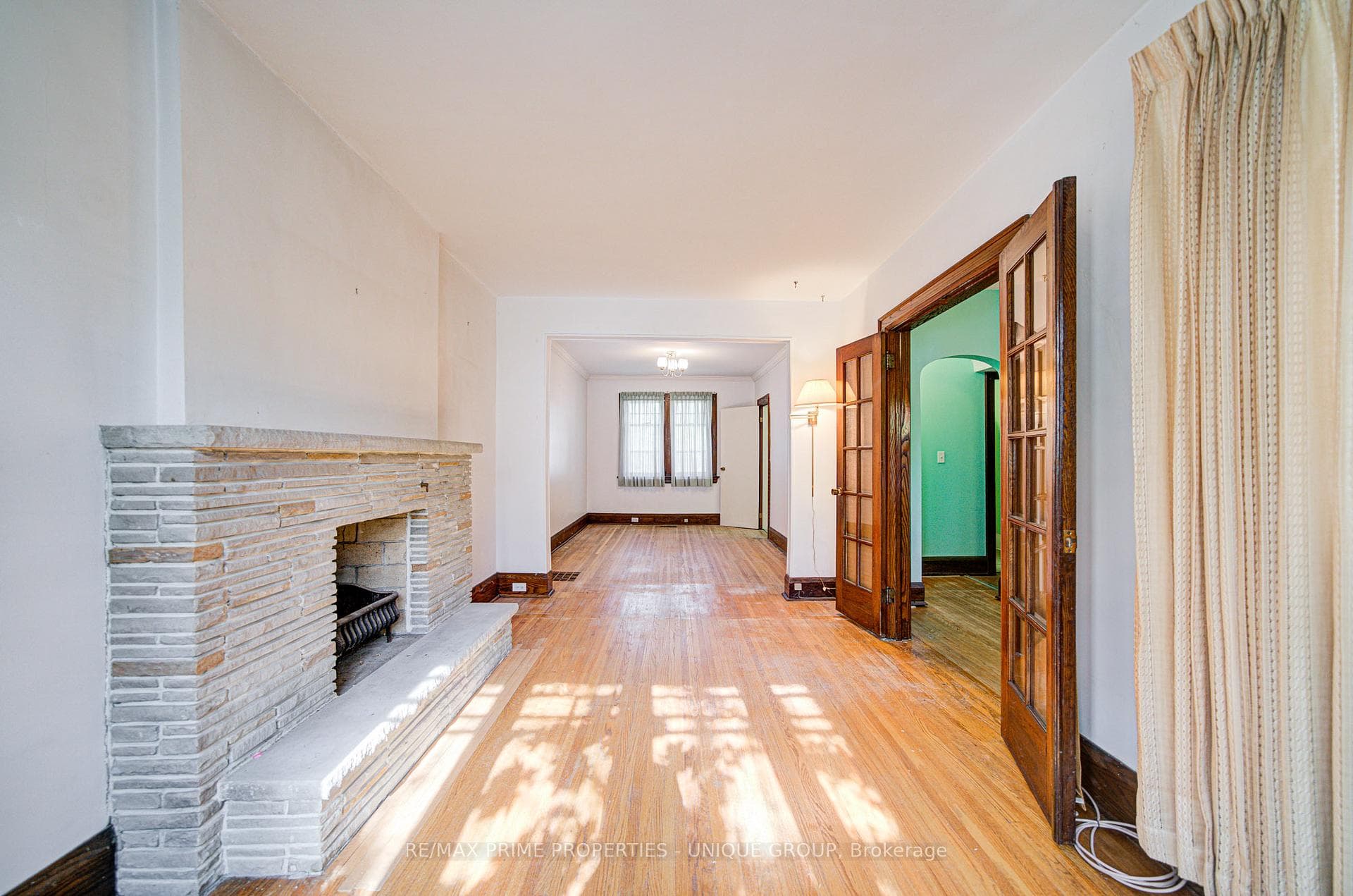 Living room with french doors to foyer.