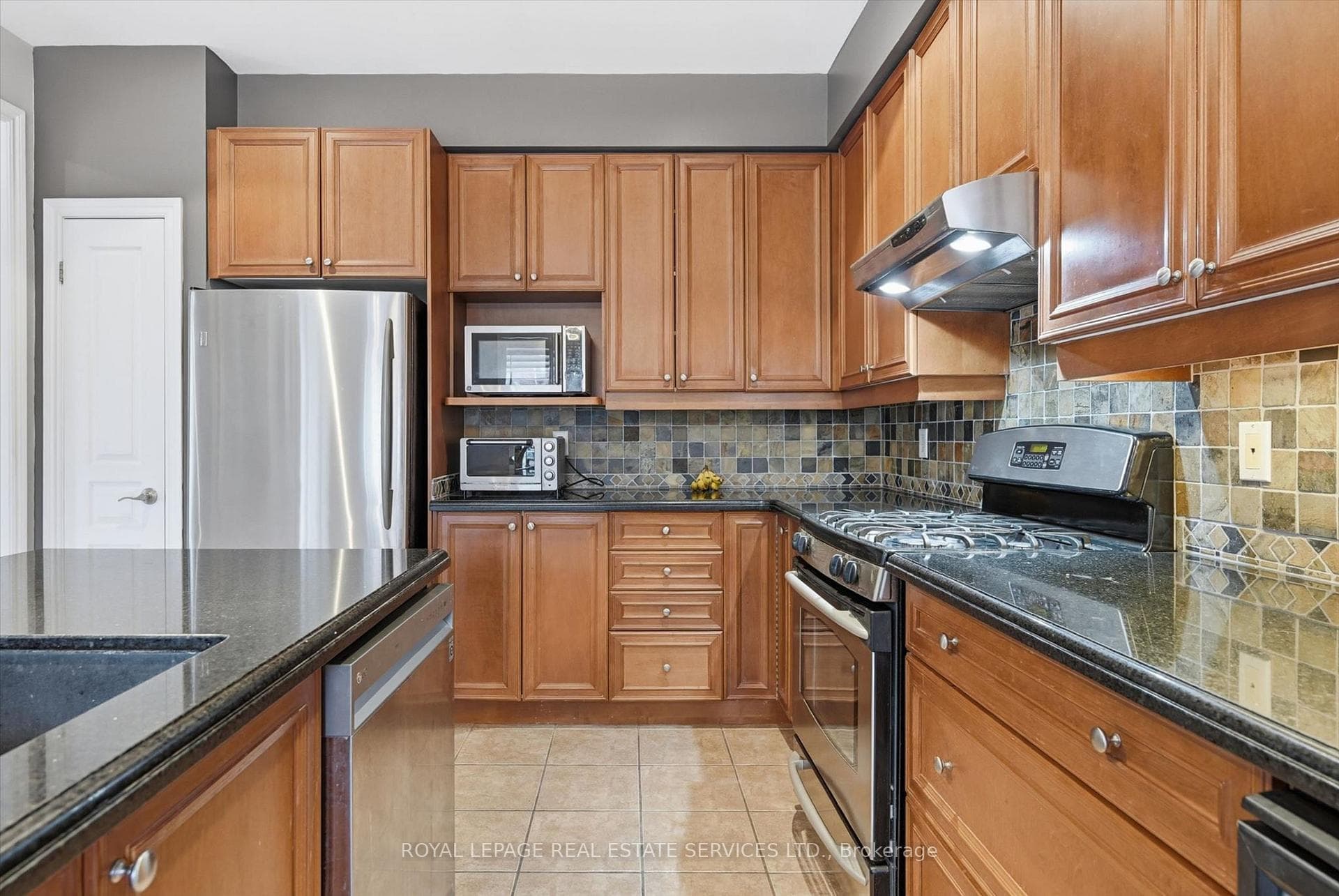 Gourmet Kitchen Offers a Pantry & S/S Appliances