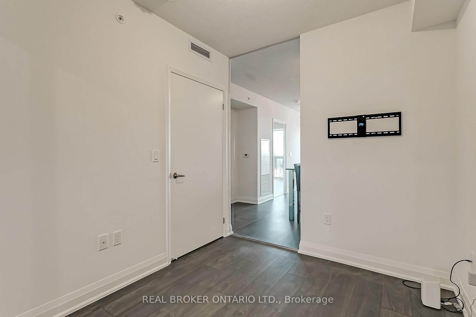 Second Bedroom with door close overlooking kitchen