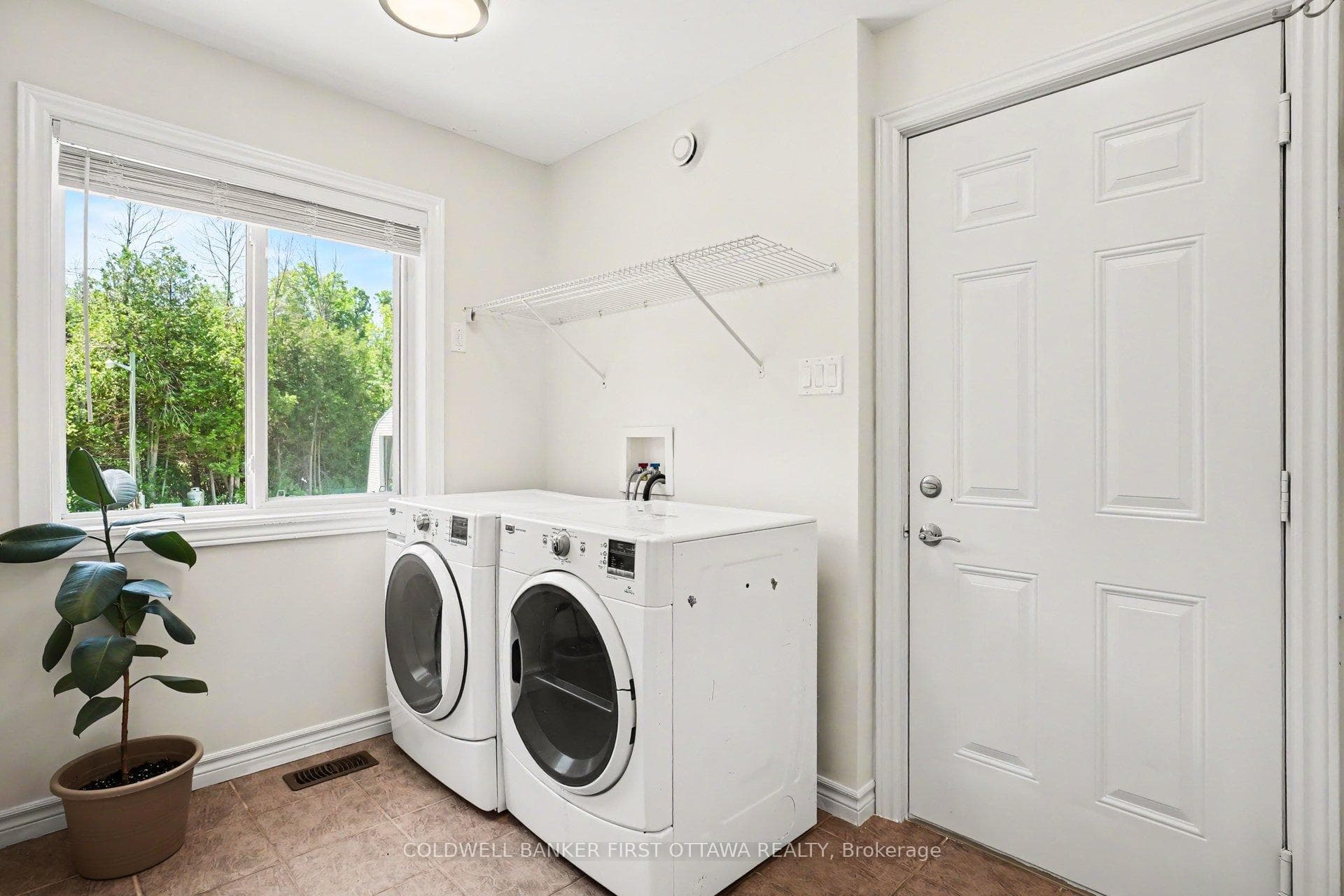 Laundry room w door to attached garage