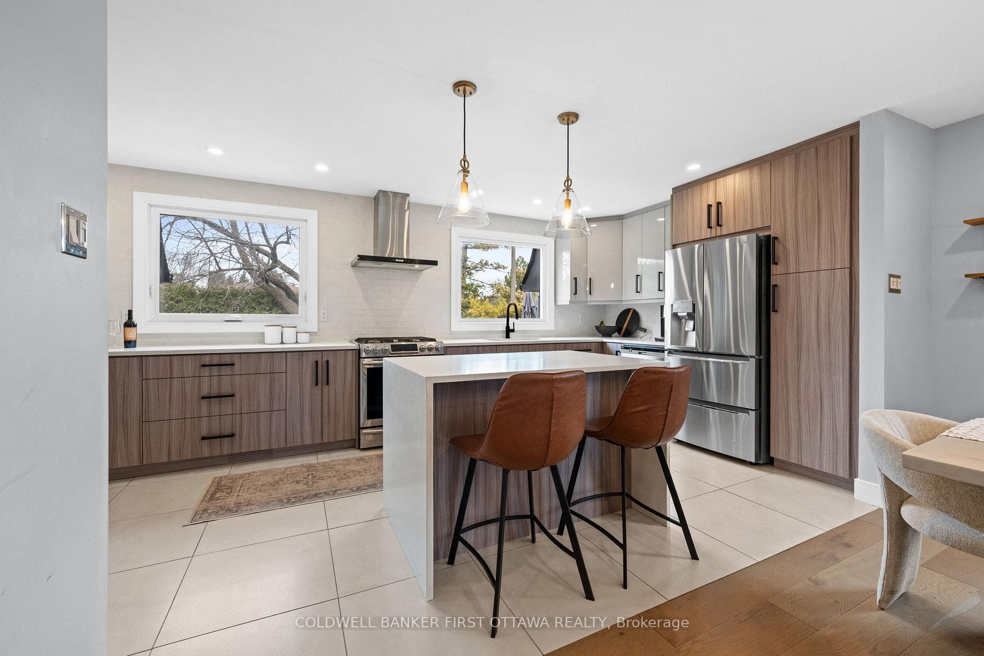 Chef inspired kitchen w waterfall island.
