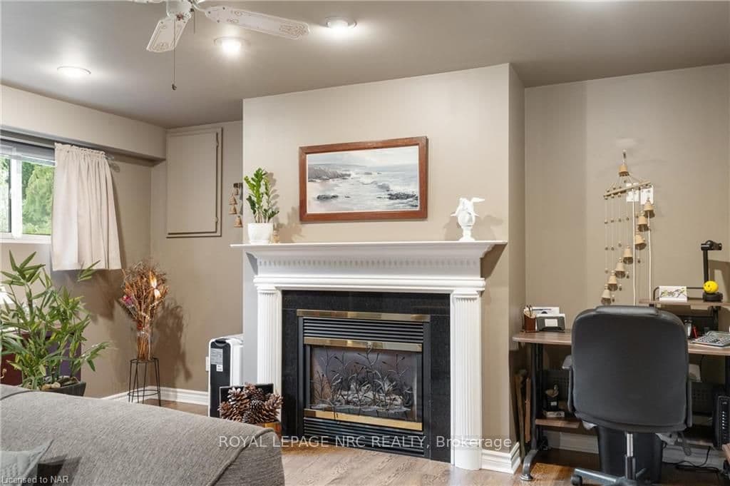 Lovely fireplace with mantle and room beside for s