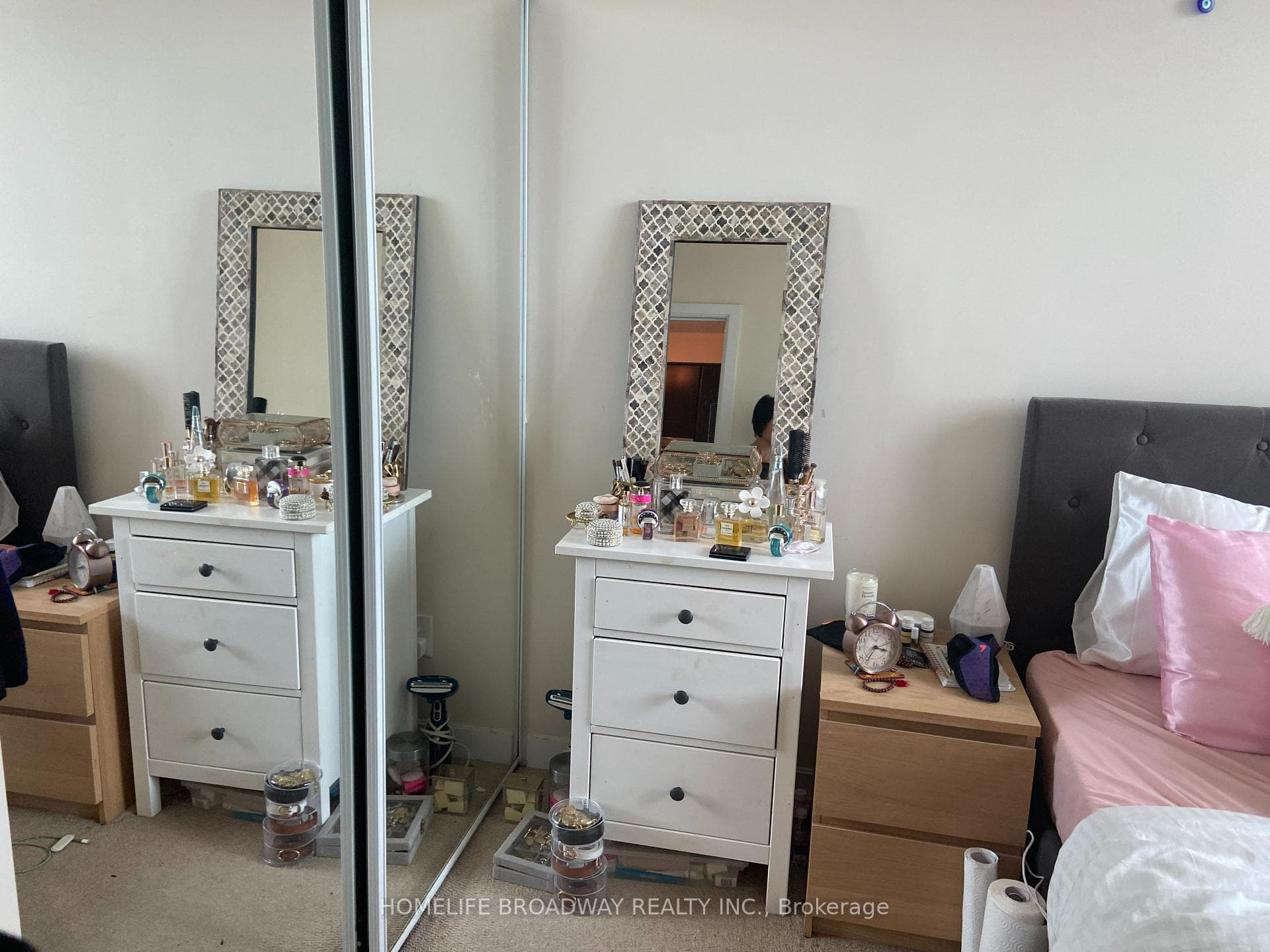 bedroom with large mirror closet