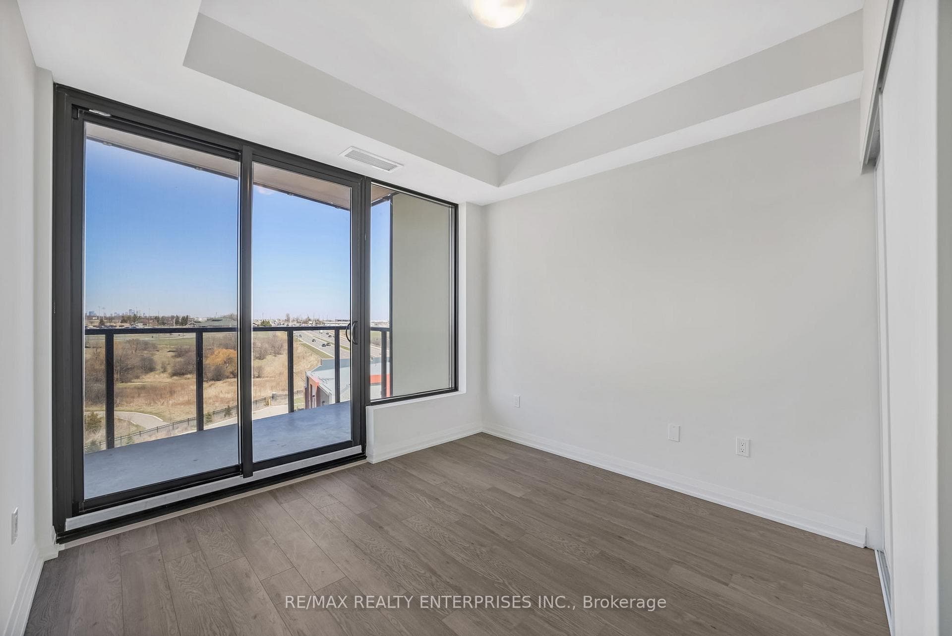 Primary Bedroom W/Sliding Door W/O To Balcony