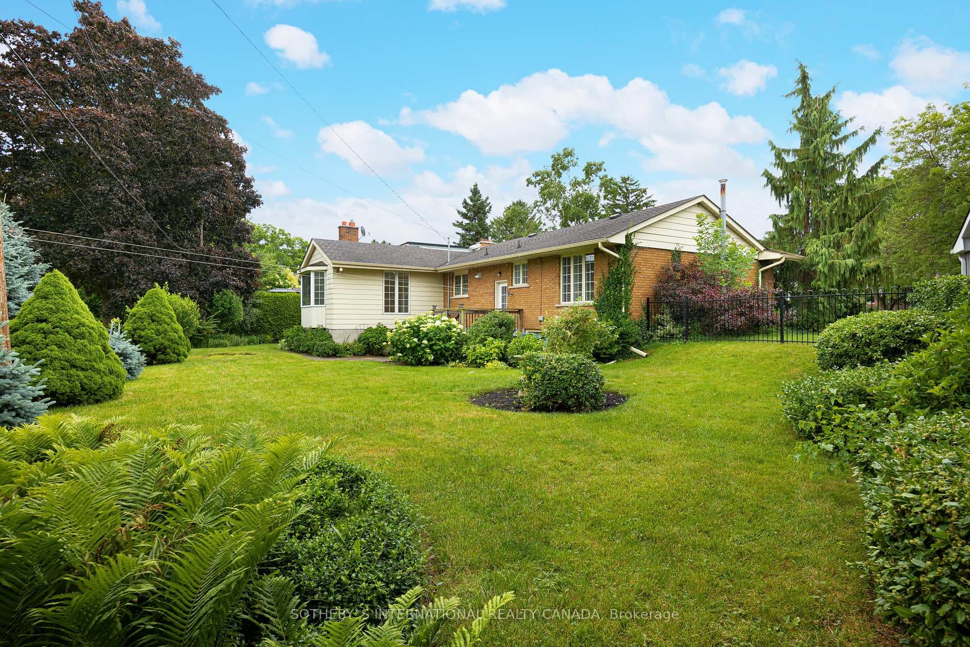 Fenced rear yard backing onto Park