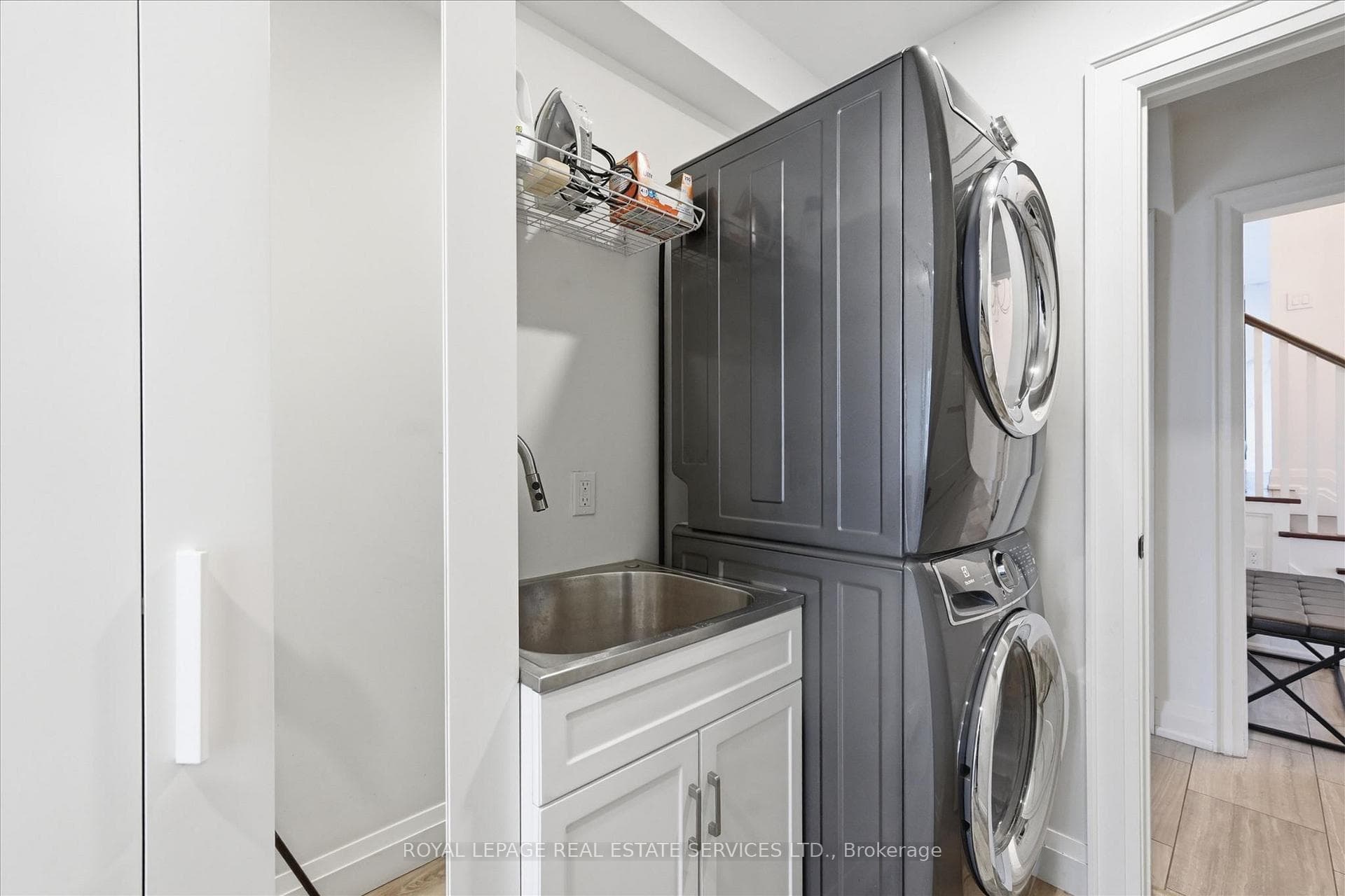Laundry with Stacked Electrolux Washer and Dryer
