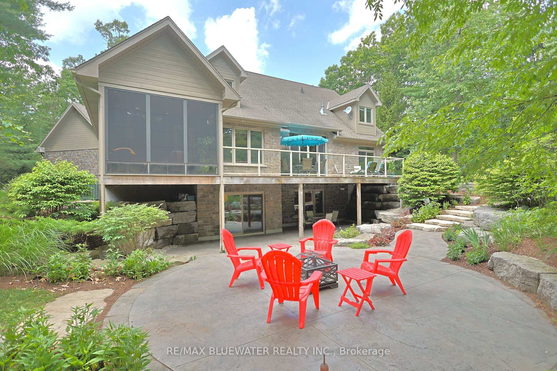 Landscaped backyard with concrete patio area