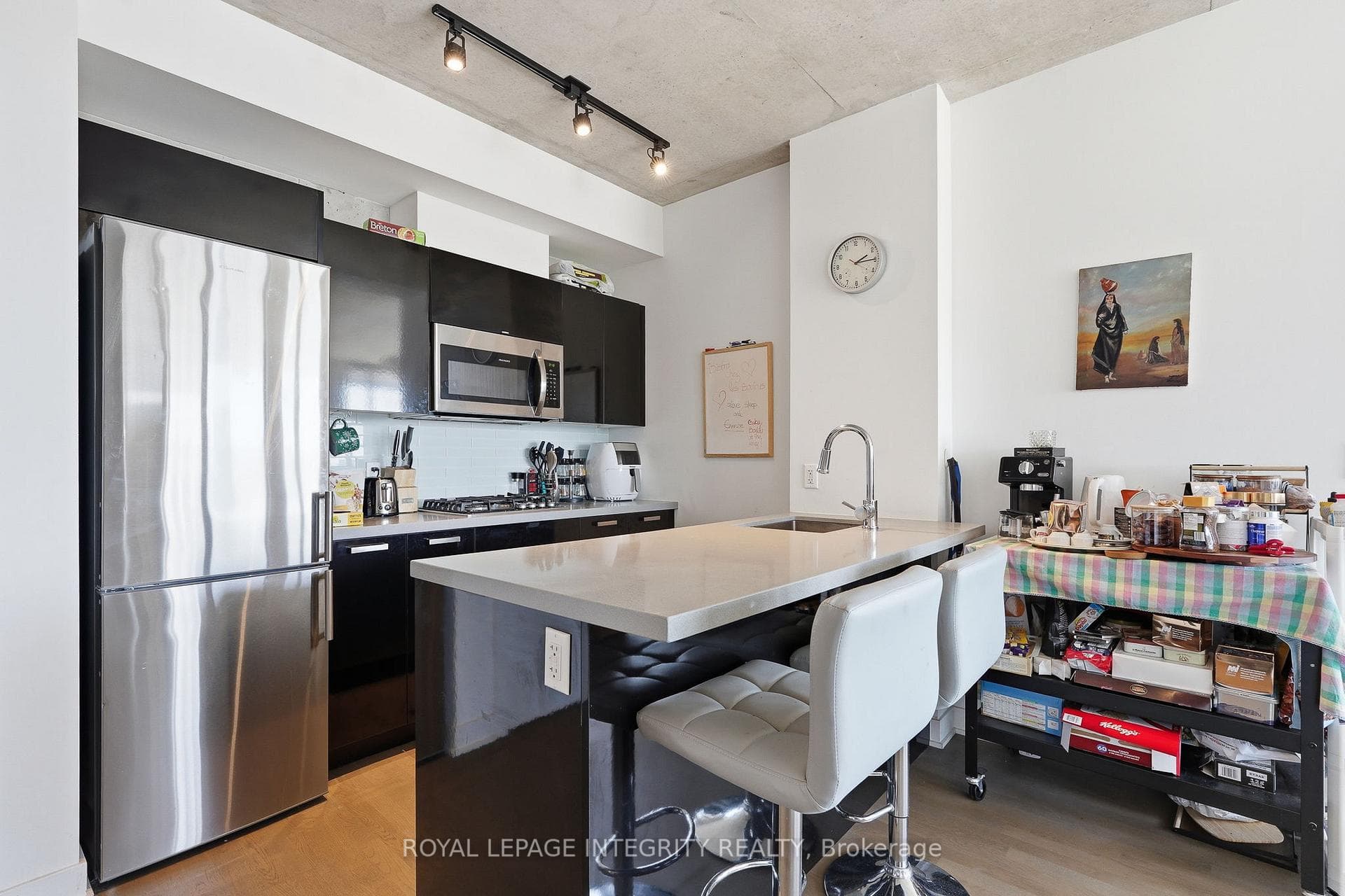 Kitchen with stainless steel appliance