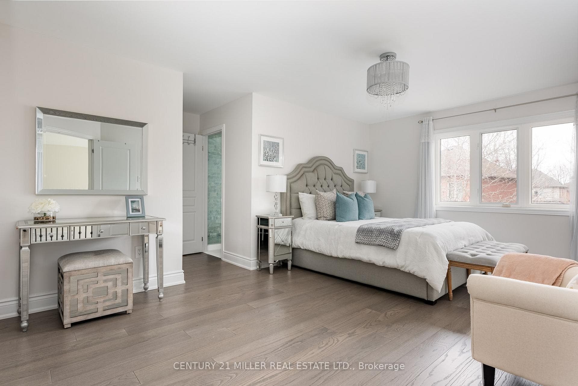 Spacious Primary bedroom with hardwood flooring