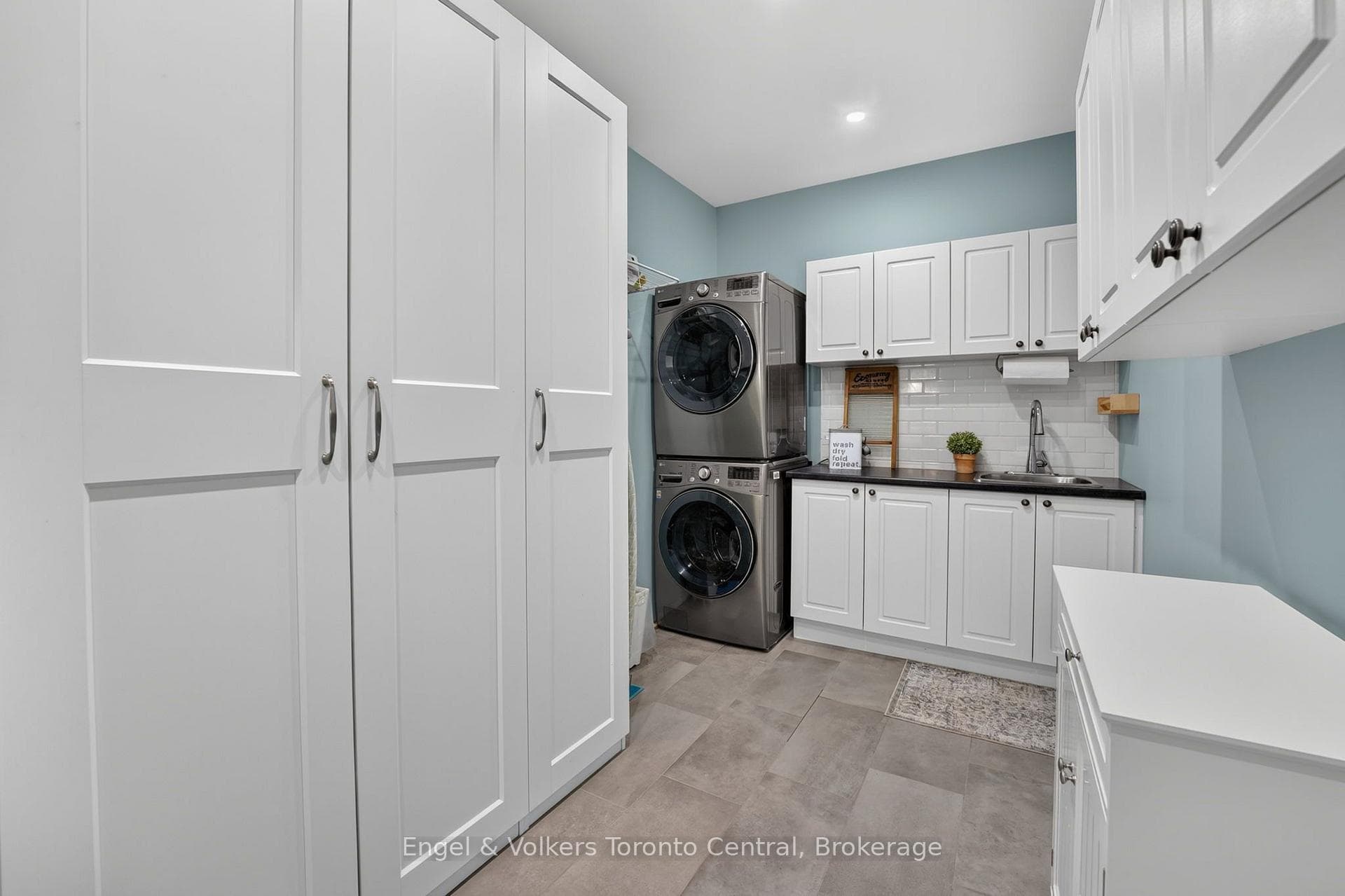 Mudroom with laundry and garage access