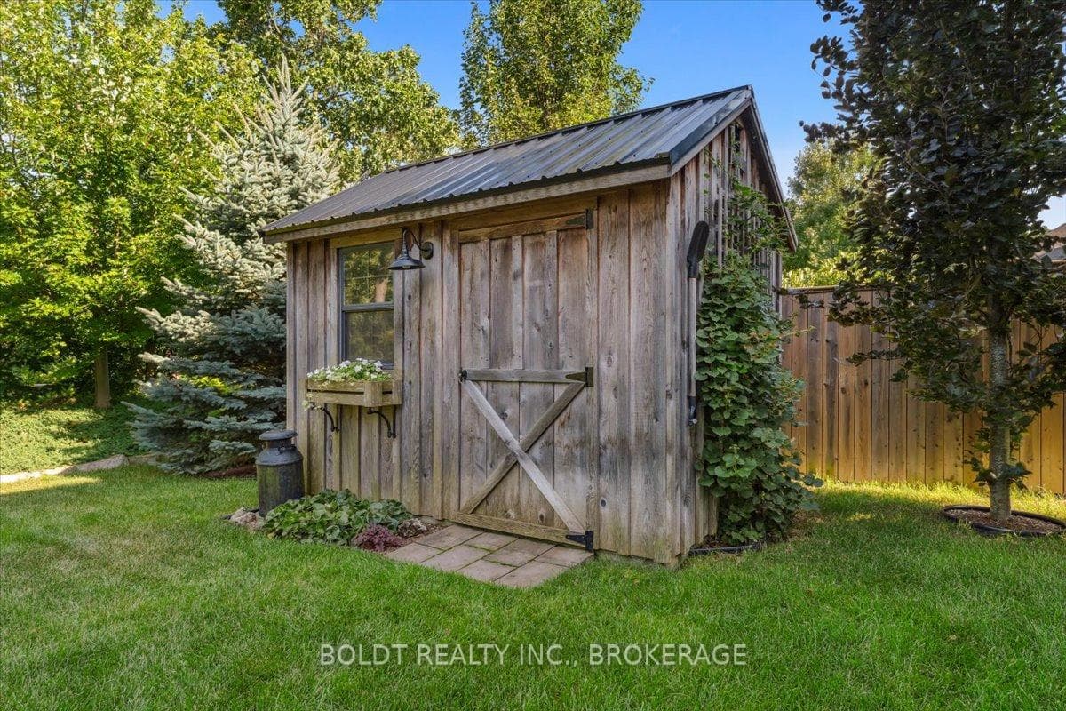 Solid Hemlock shed with metal roof, concrete pad.