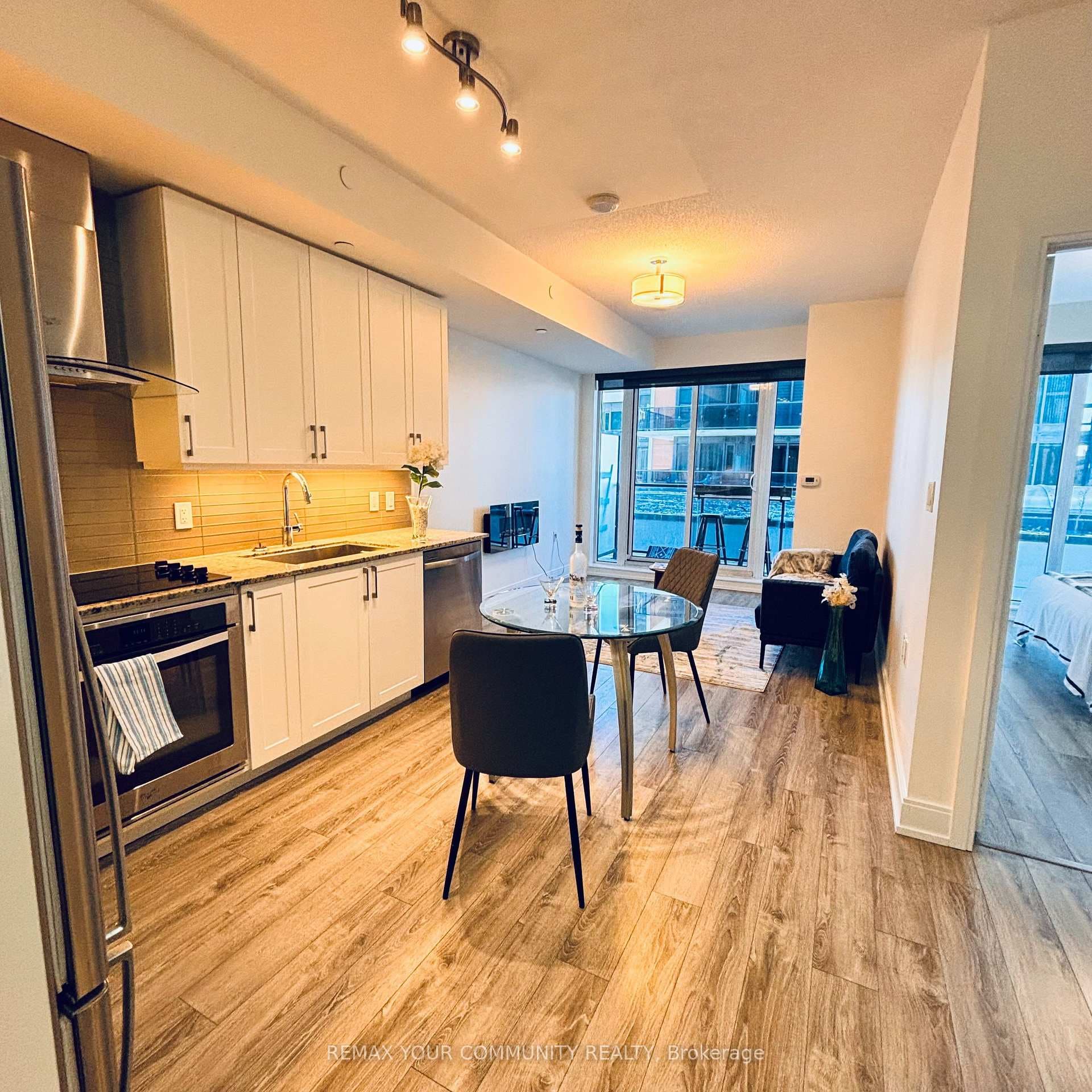 Open living and dining with private balcony