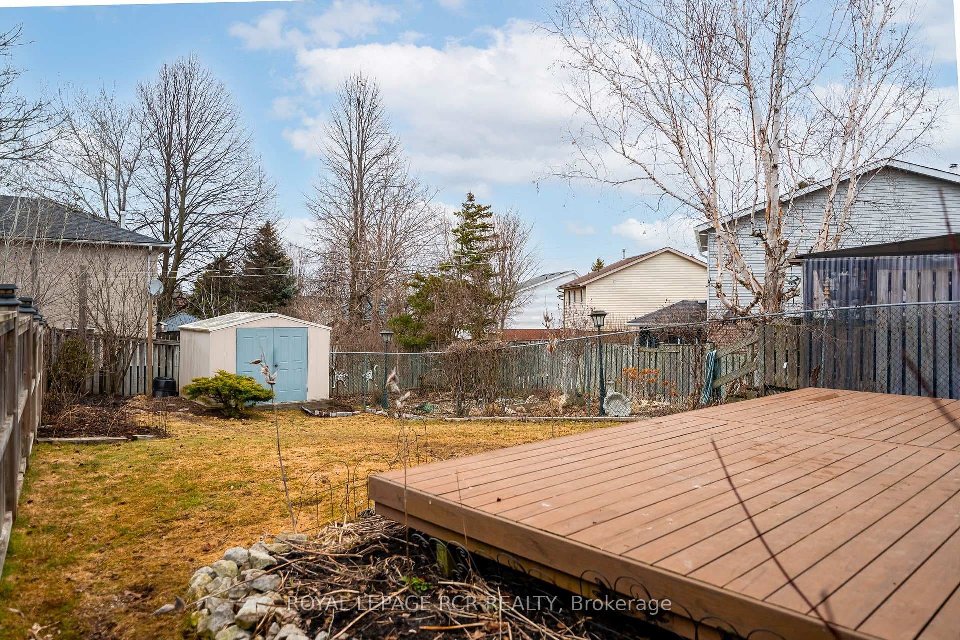Backyard with composite deck & garden shed