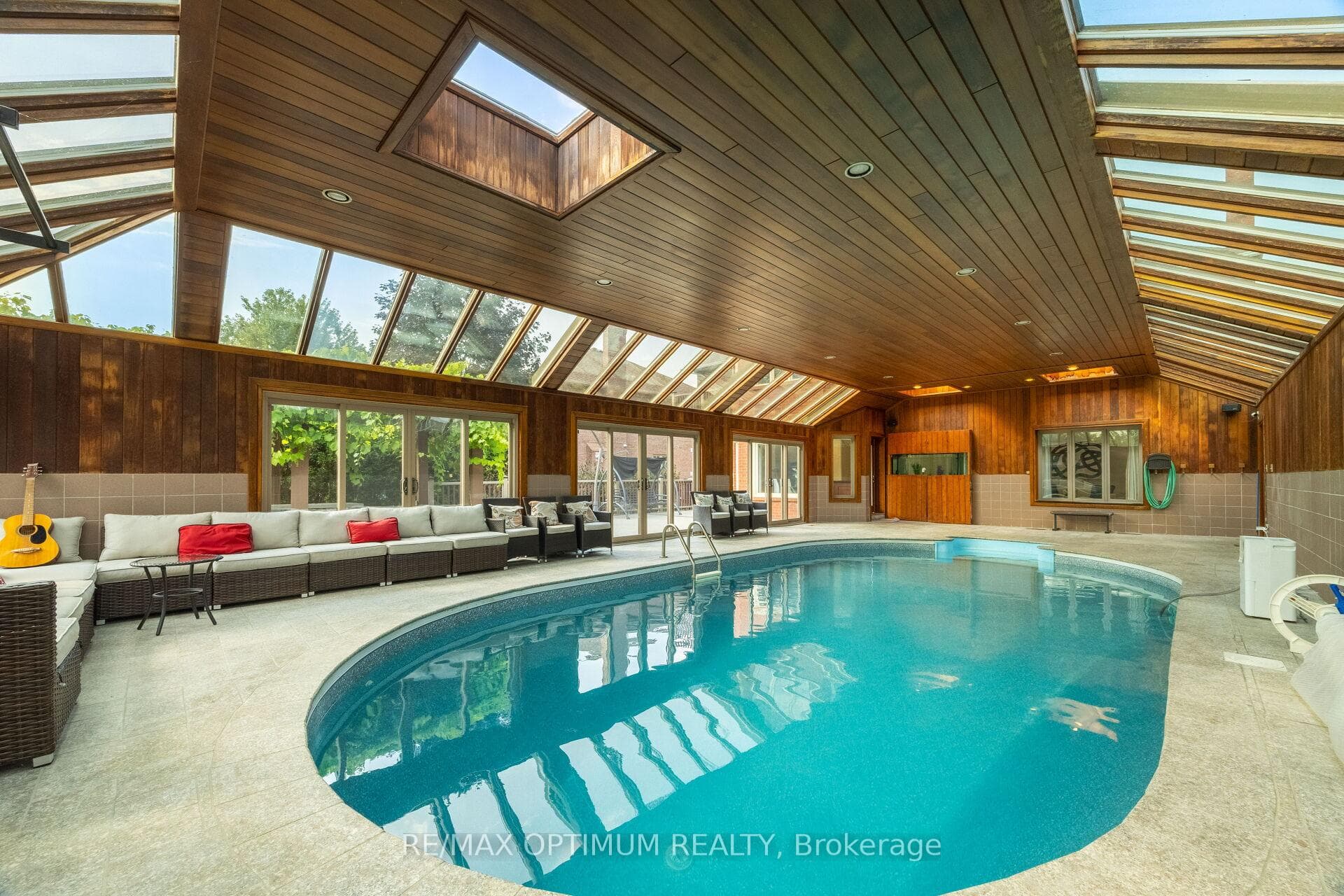 Indoor pool oasis with lounge seating