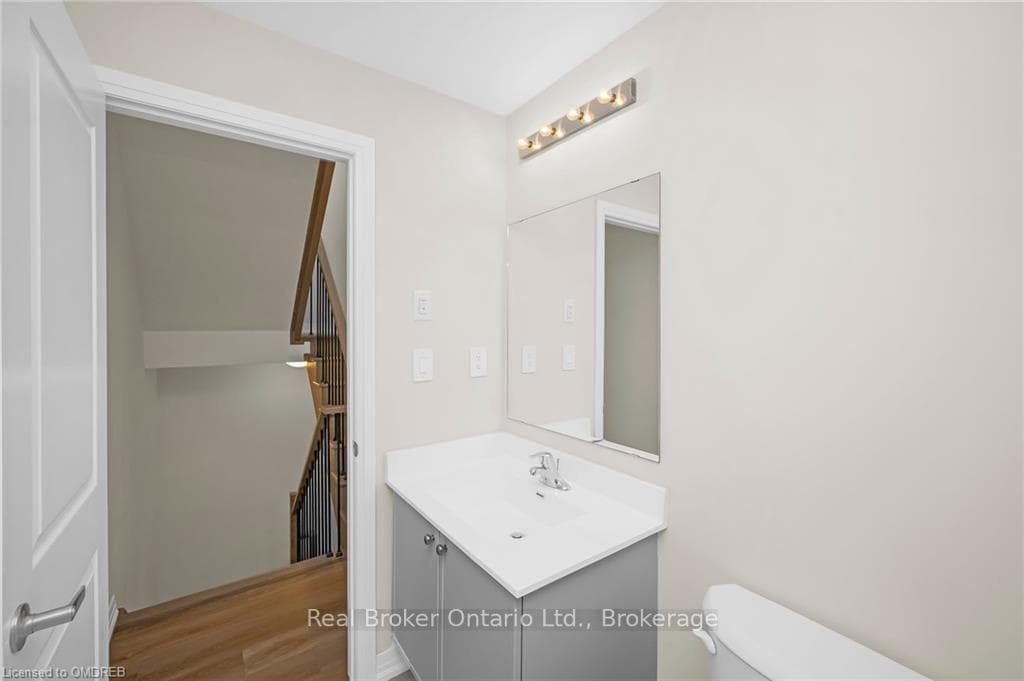 Bathroom featuring hardwood / wood-style floors, v