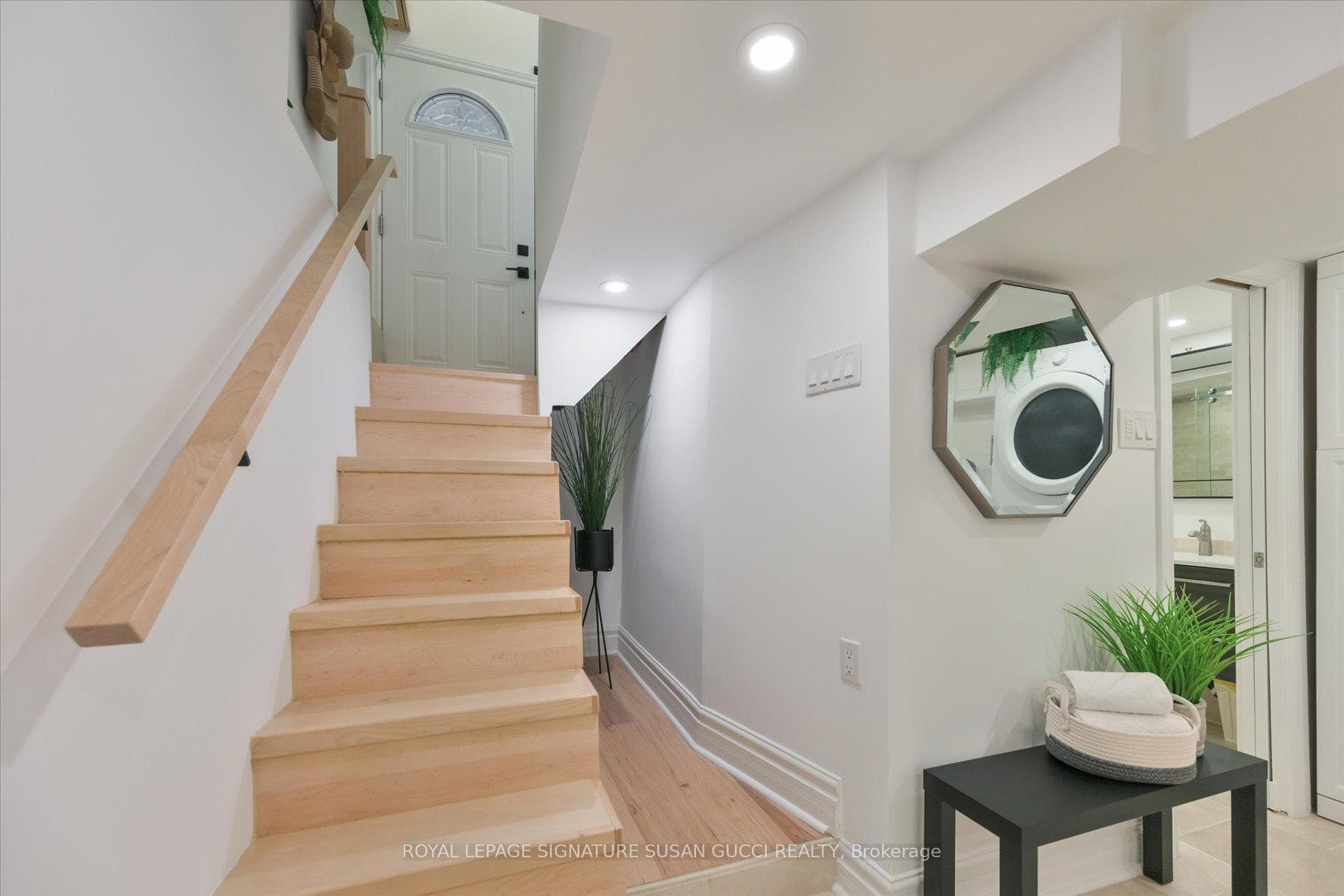 Stairs to basement with back door at top