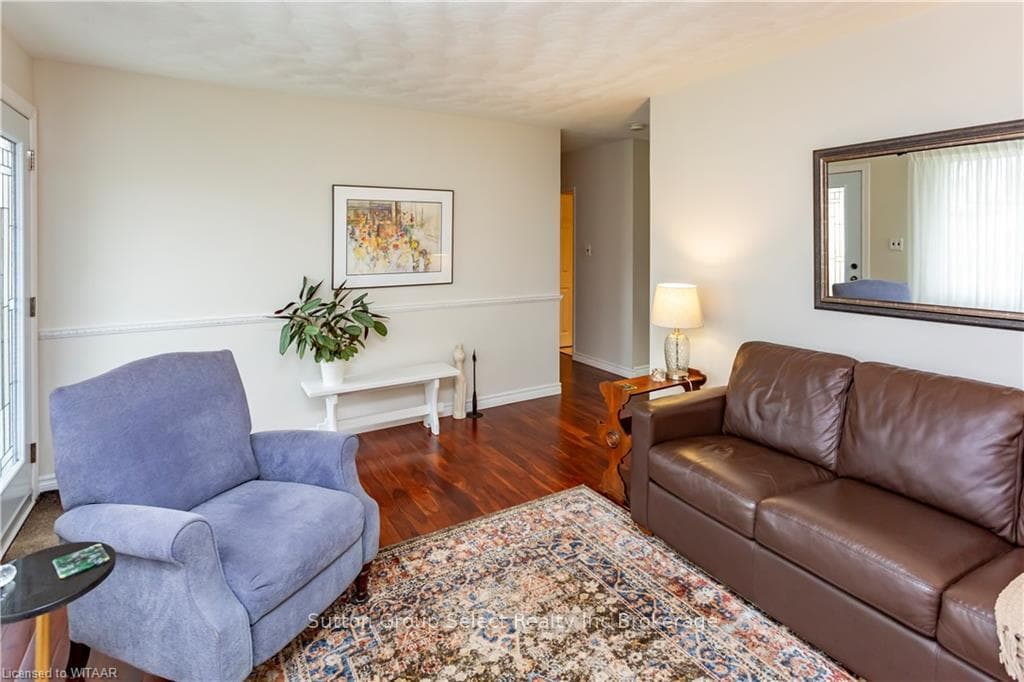 Living room featuring dark wood-type flooring and