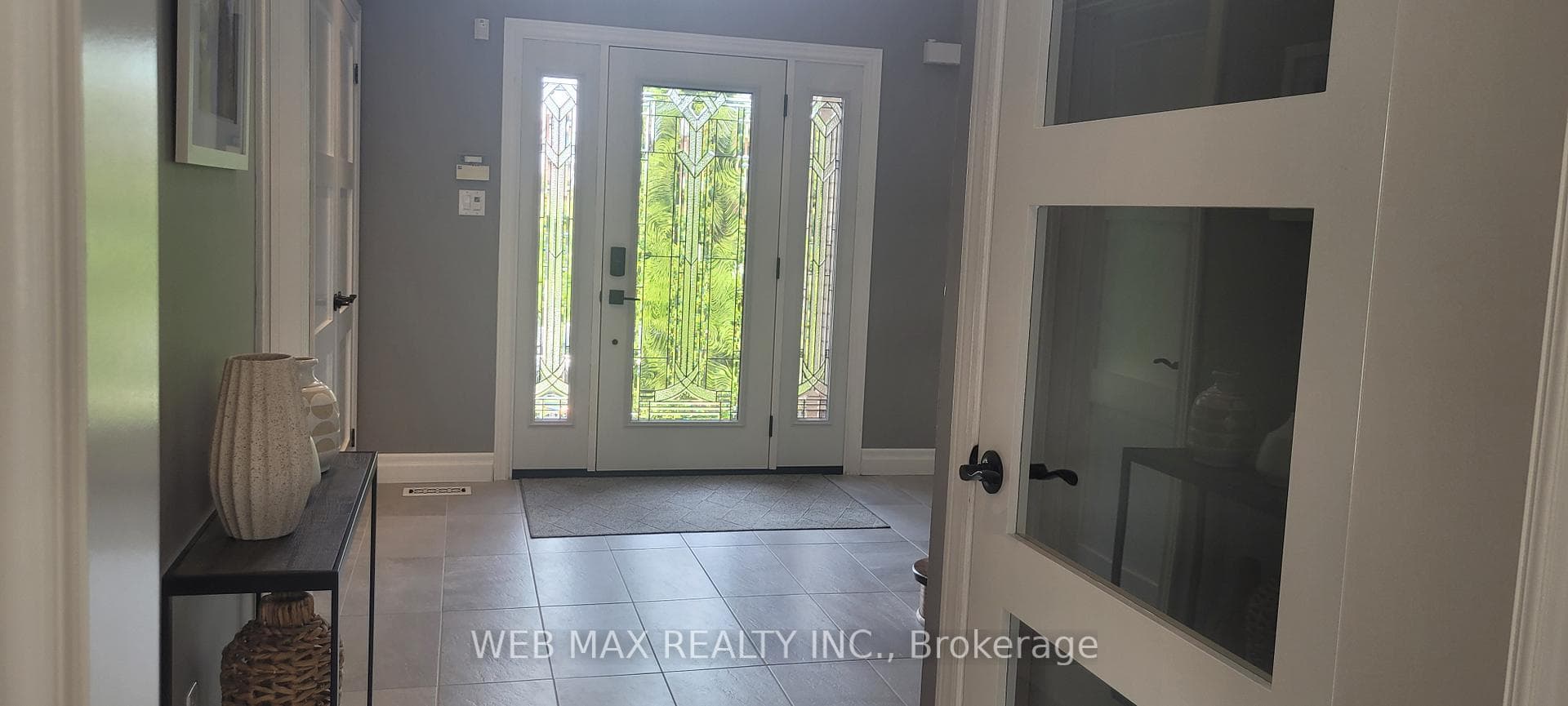 new entry door with side lights, porcelain floor