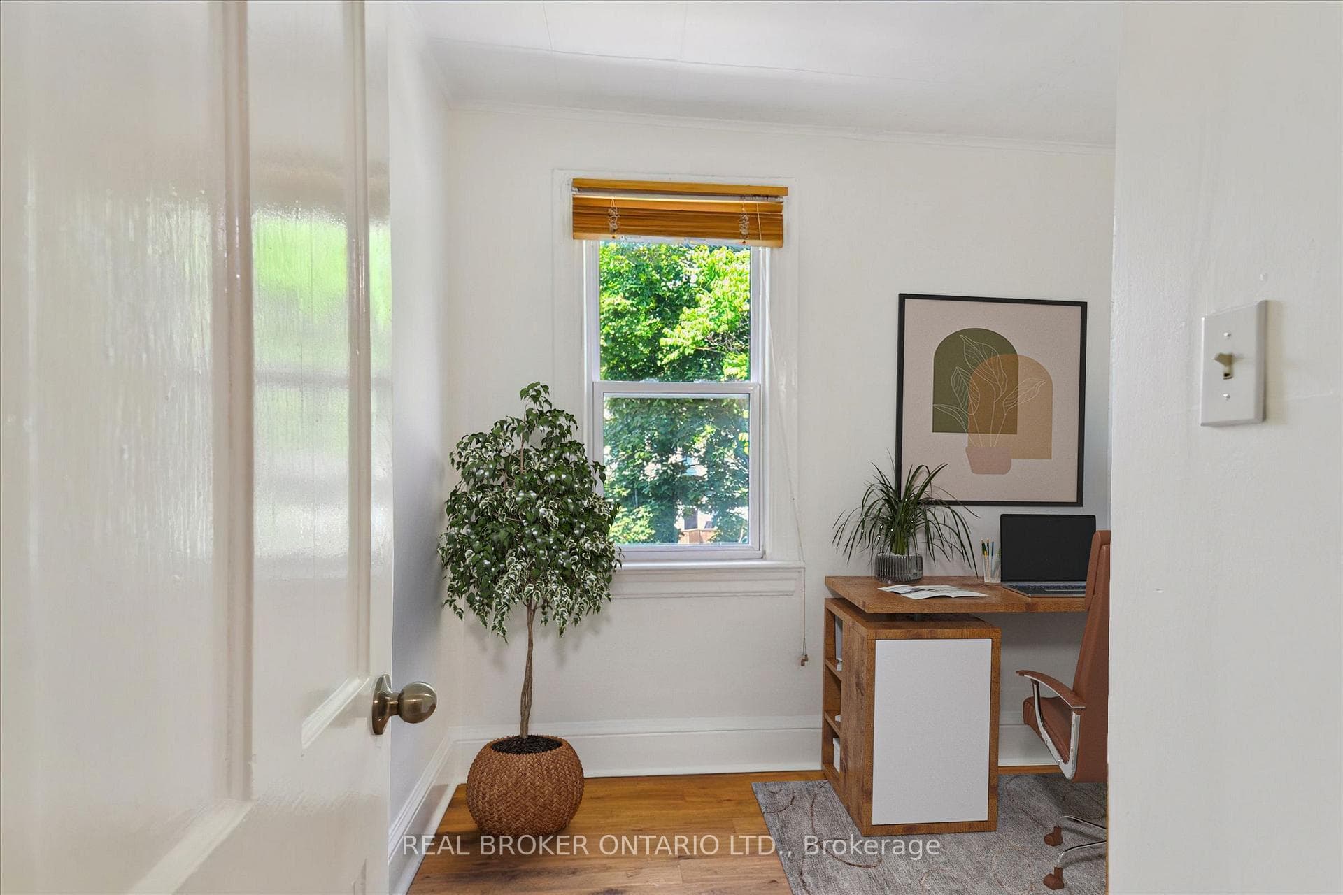 3rd bedroom staged as a home office