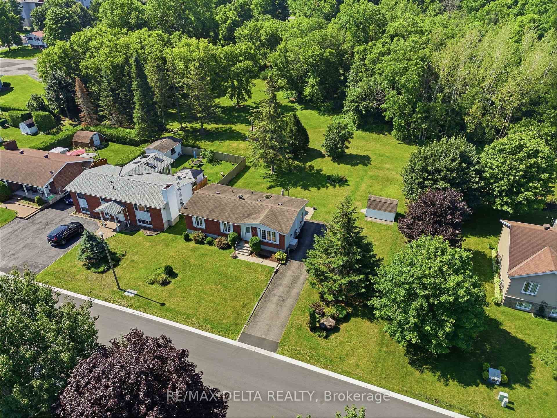 Vacant land behind the home gives privacy.