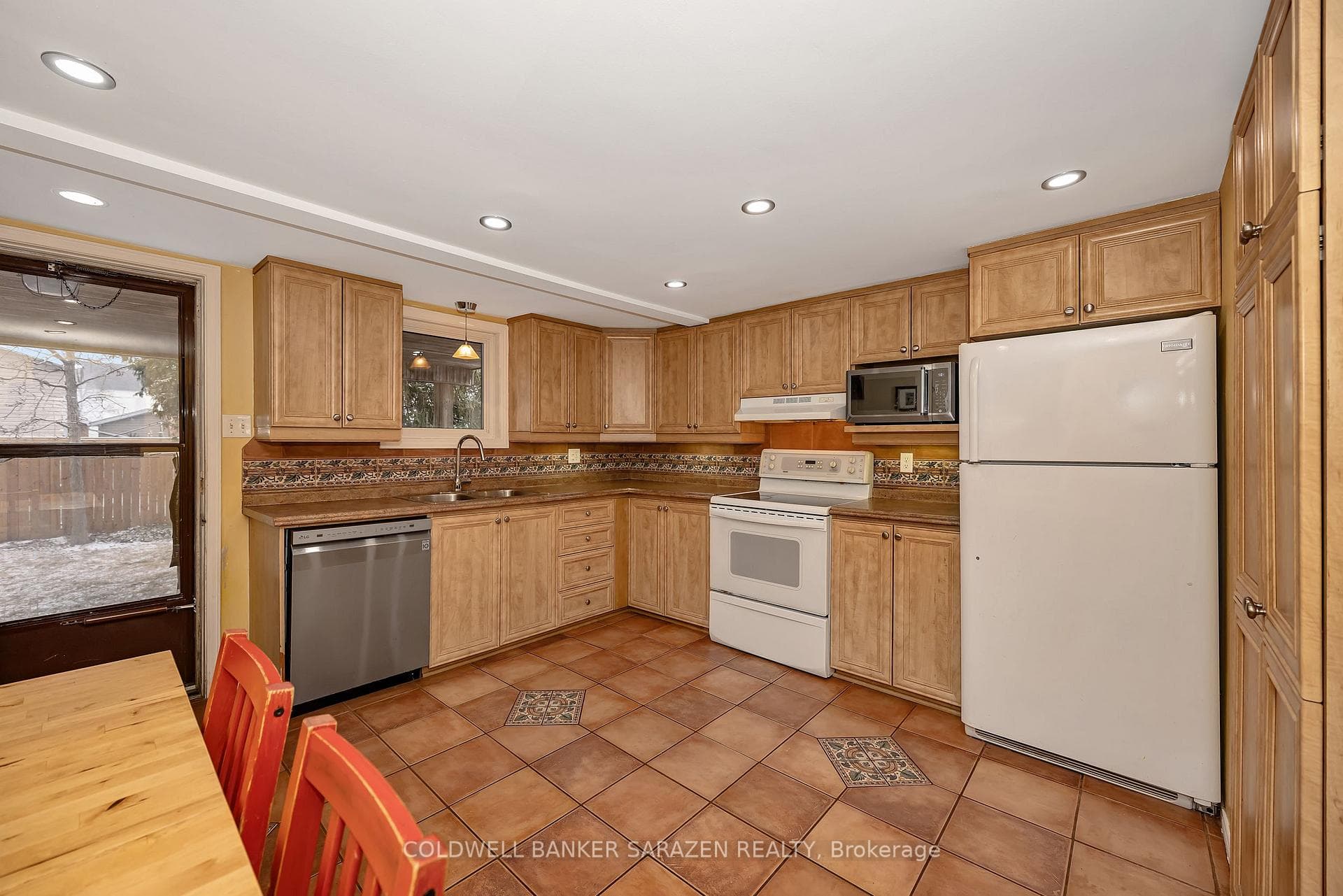 Large eat-in kitchen -door leading to covered deck