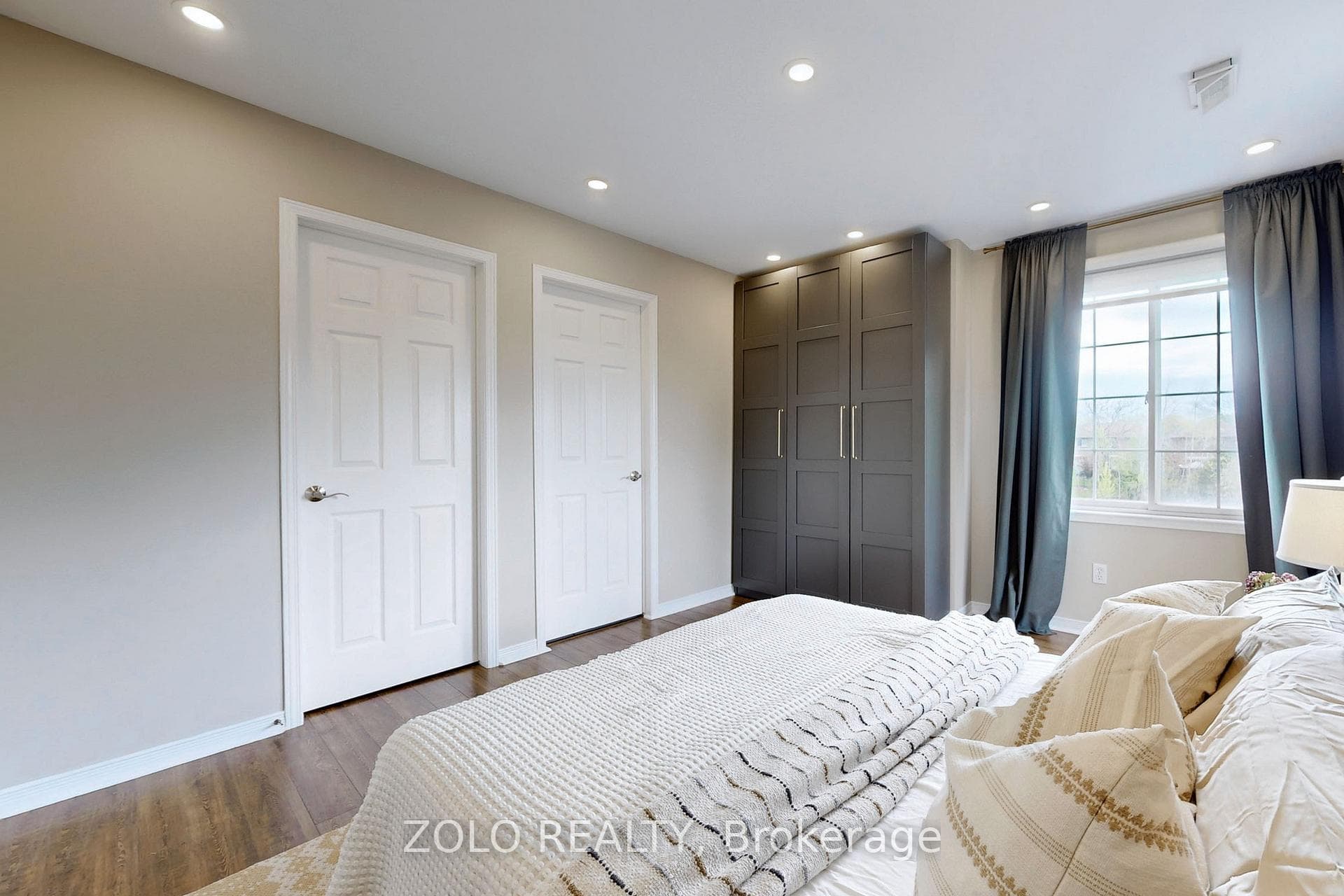 Primary Bedroom with wardrobe & walk-in closet