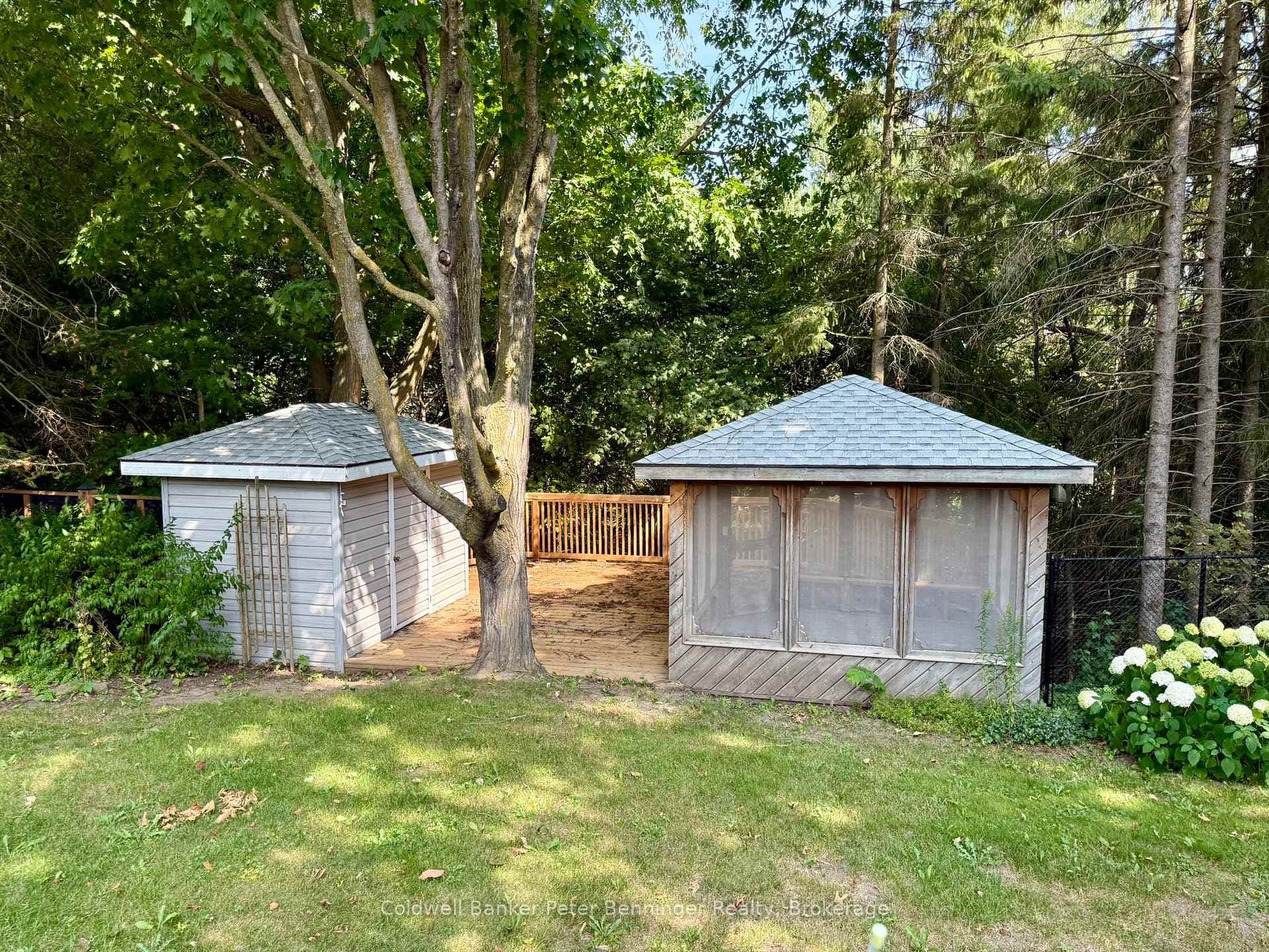 Back deck with gazebo and shed