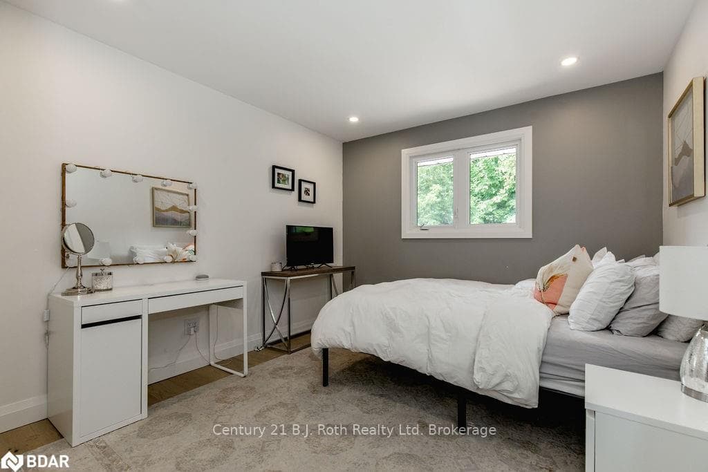 Bedroom with light hardwood / wood-style floors