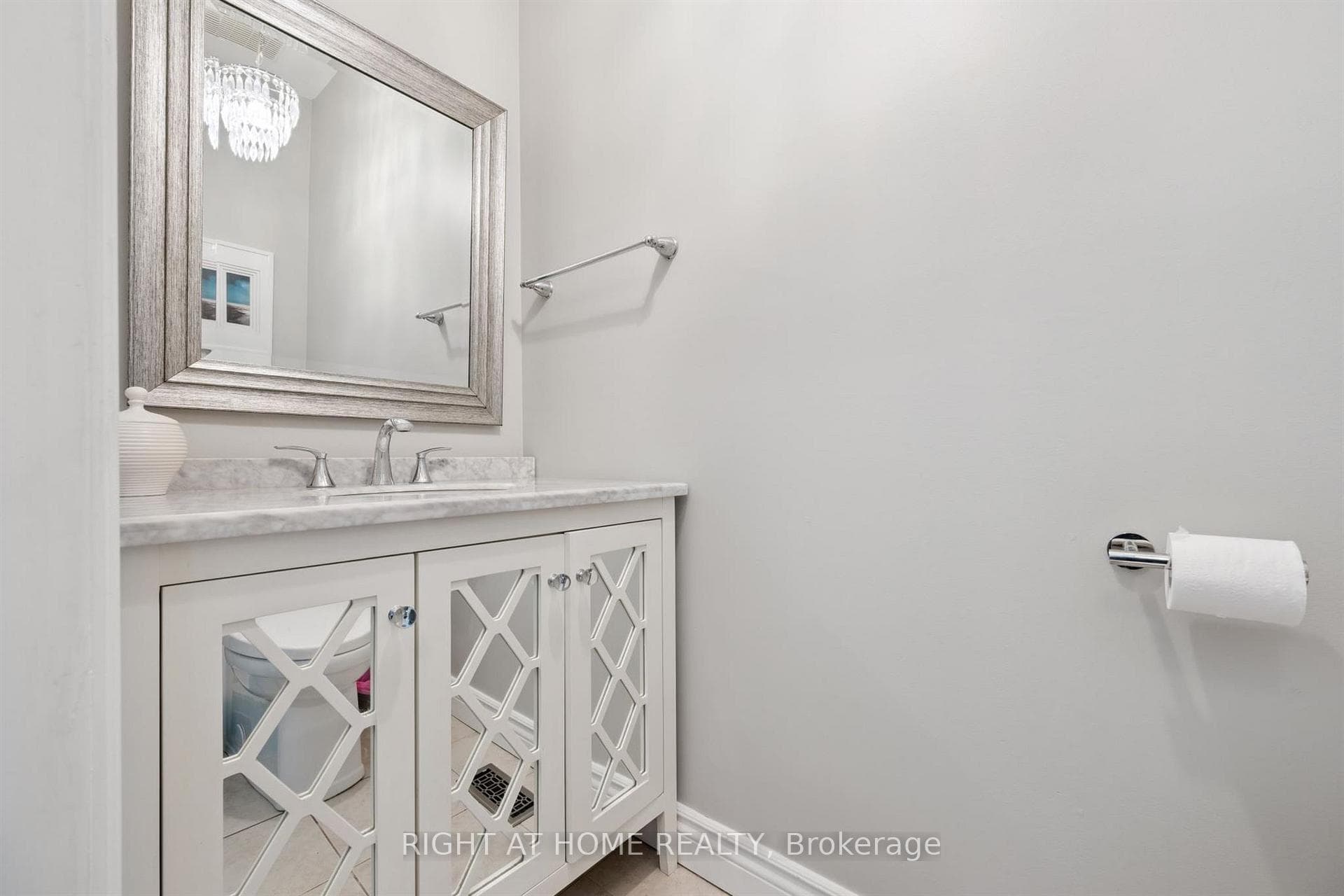 Renovated powder room tucked off the main floor.