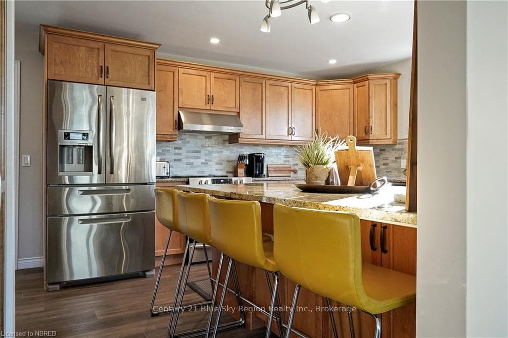 Kitchen with decorative backsplash, stainless stee
