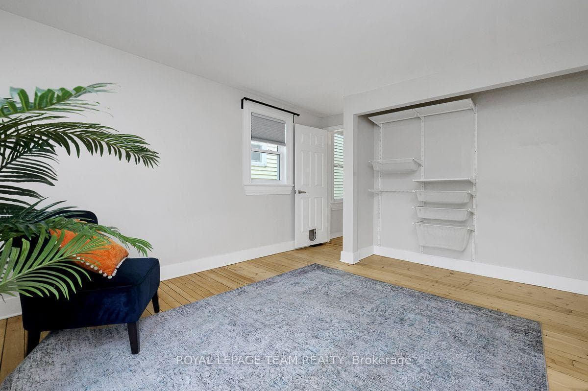Primary bedroom with large closet + organizers.