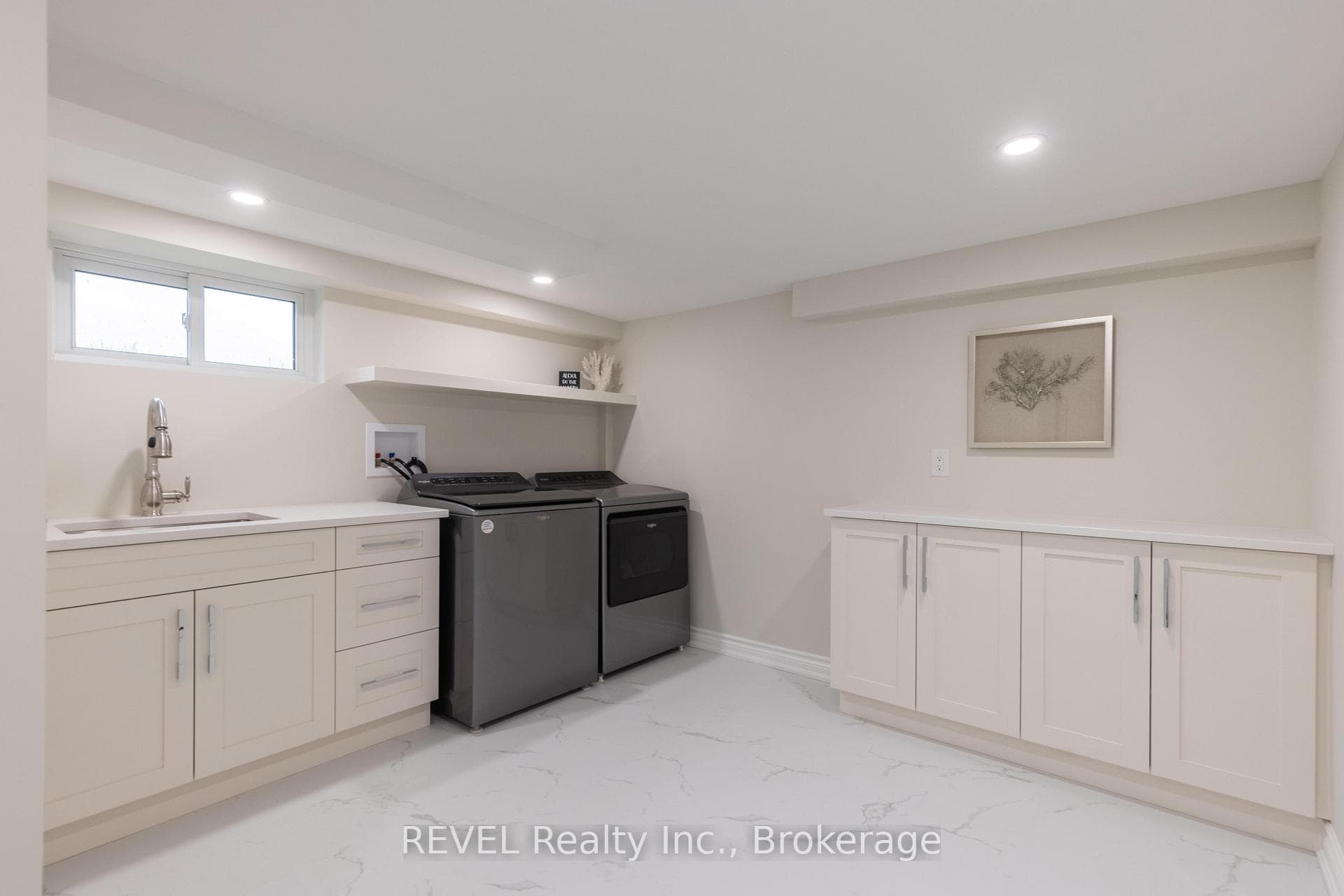 Laundry room with all quartz countertops.