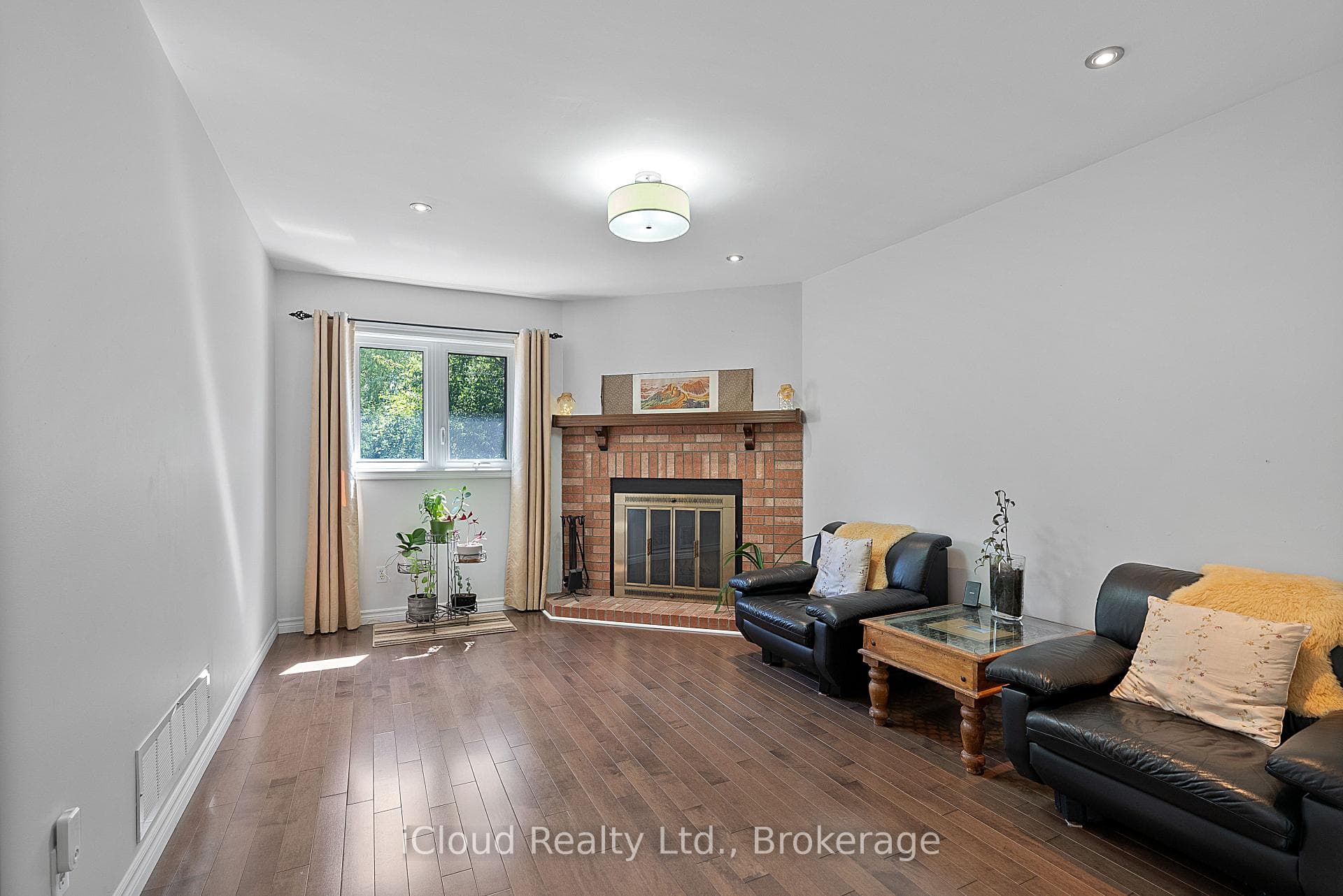 Main Floor Family Room with Brick Fireplace