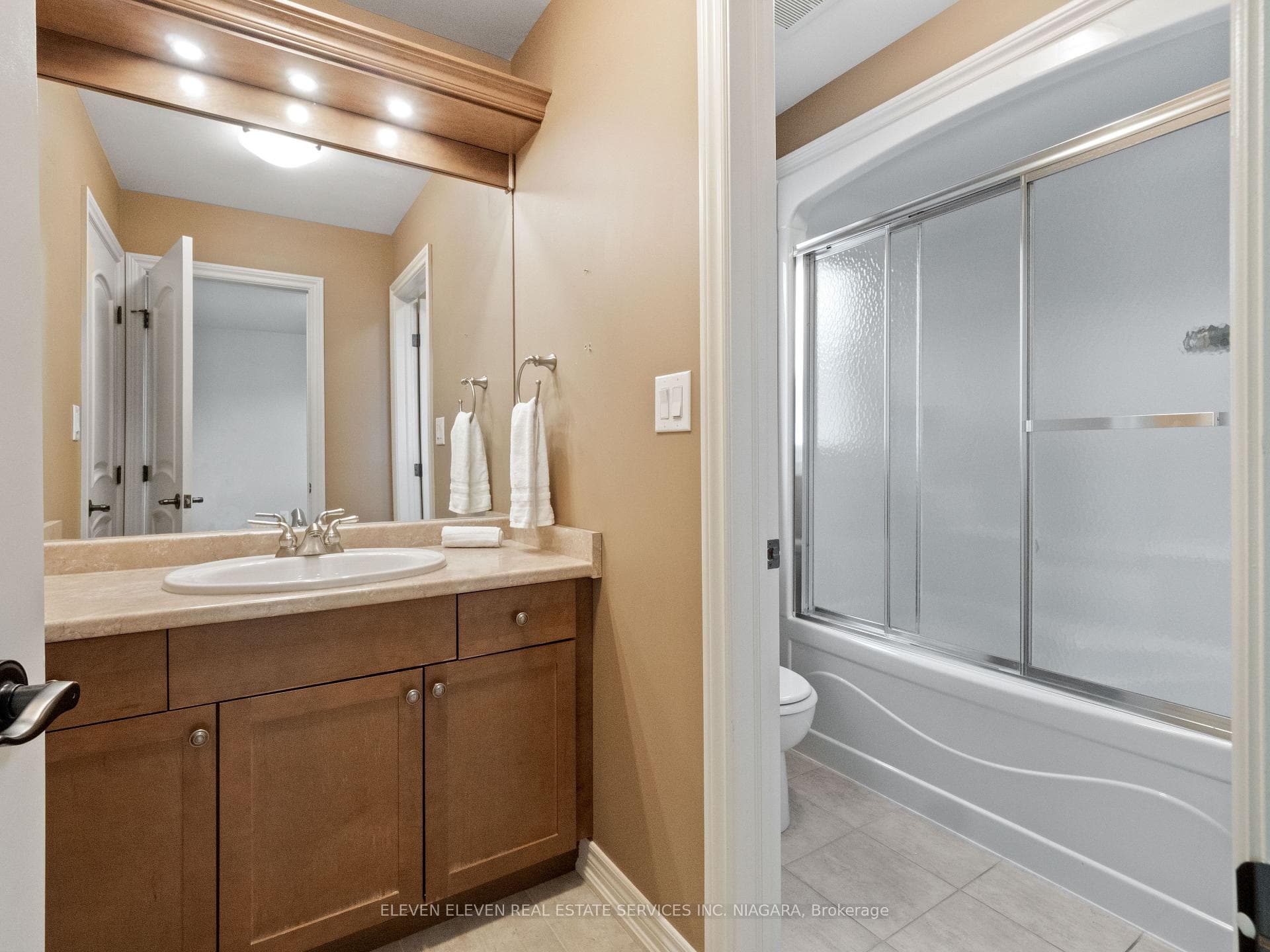 Jack n Jill Bath separating toilet/bath and vanity