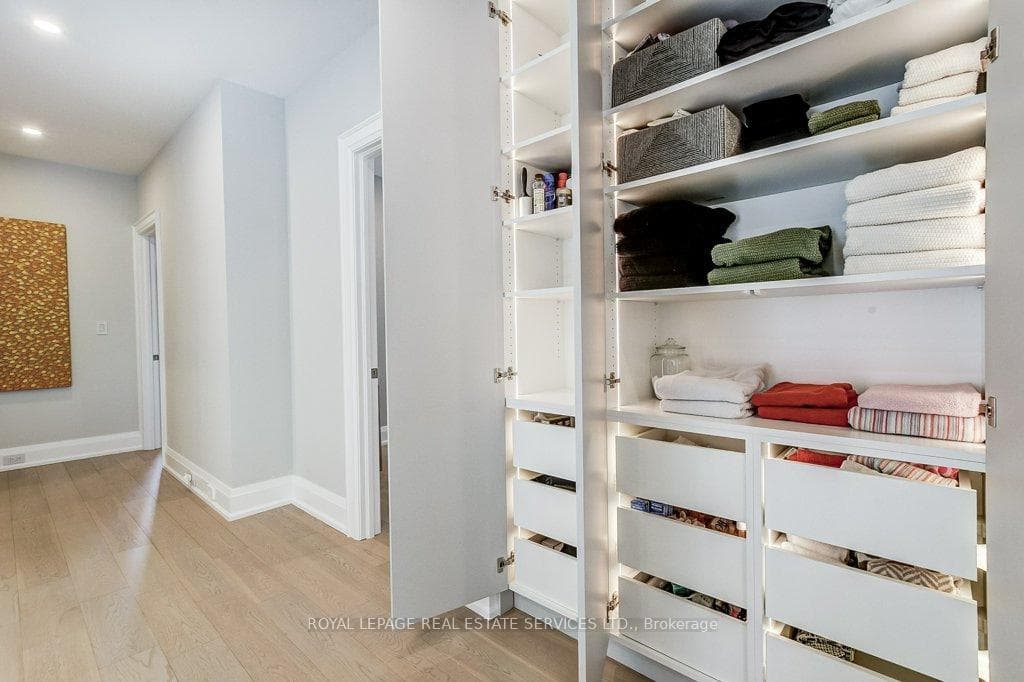 Built in Linen w/Custom LED lighting in Hall.