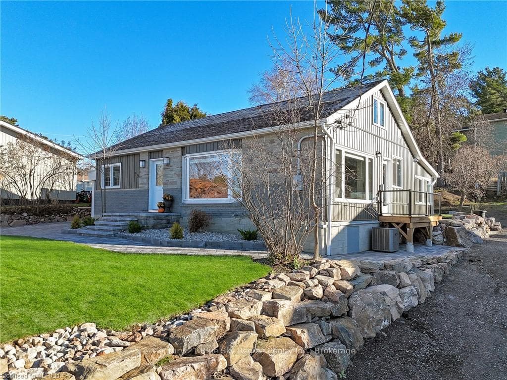 View of front of property with central AC unit and