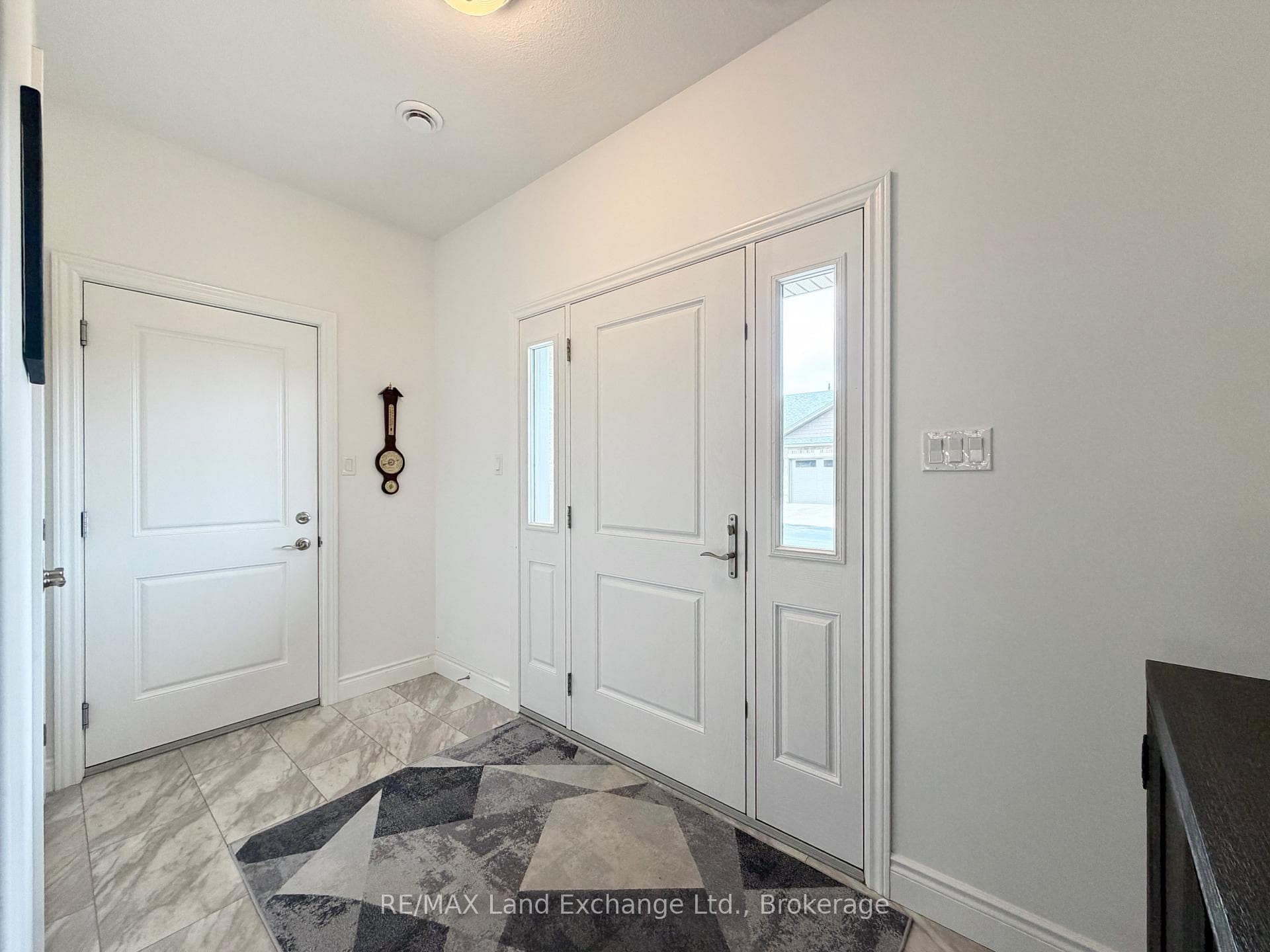 Spacious Entrance Foyer with Access to the Garage
