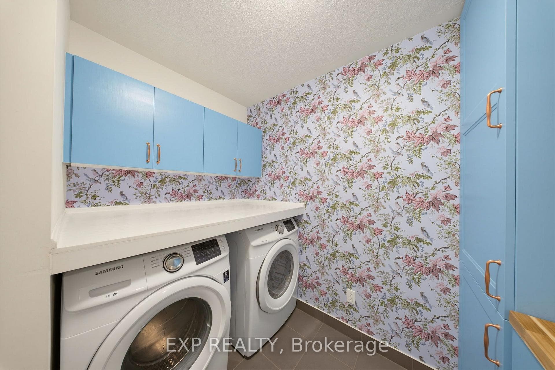 Laundry Room With Cabinetry And Counter Space.