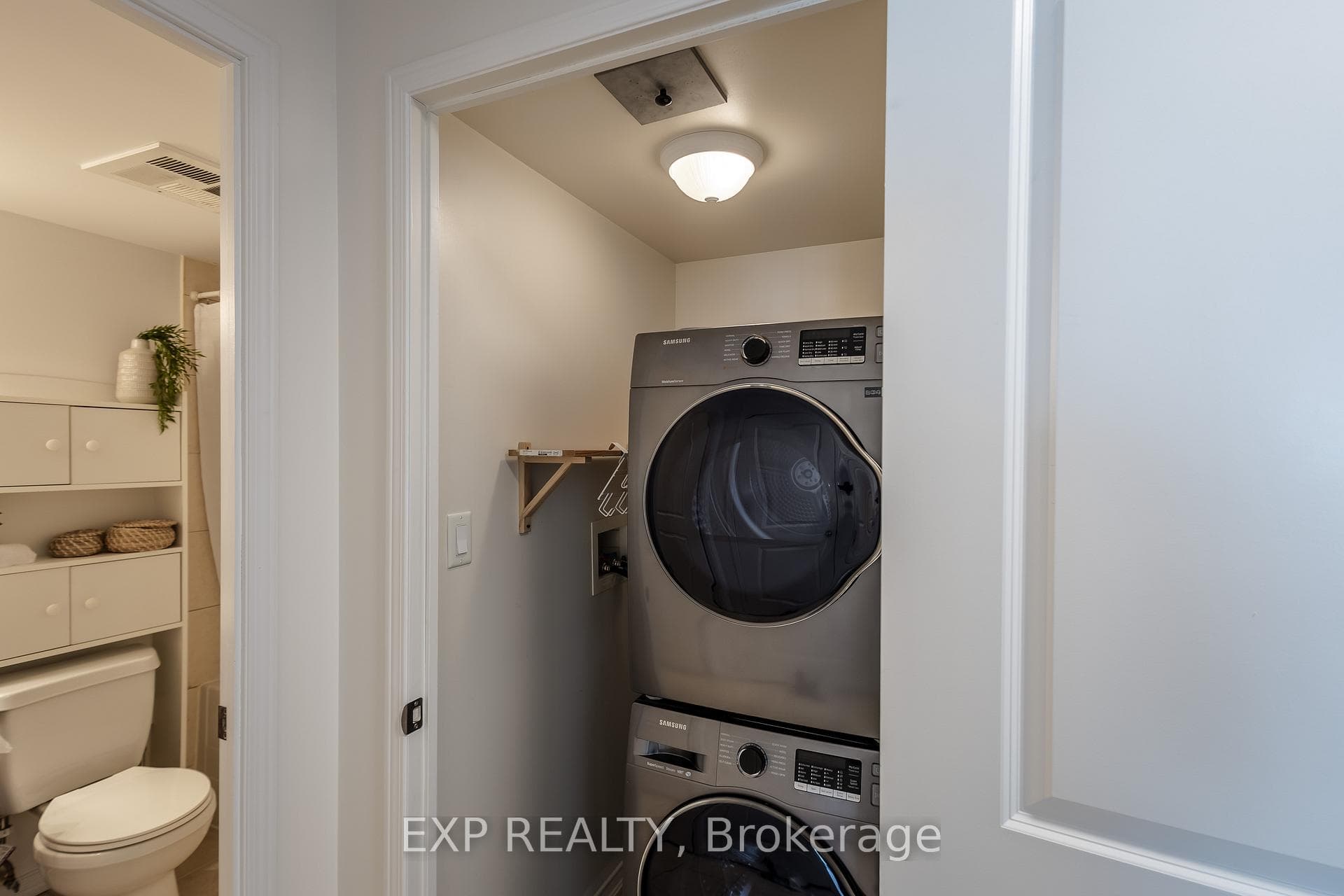 Ensuite laundry with stacked washer&dryer