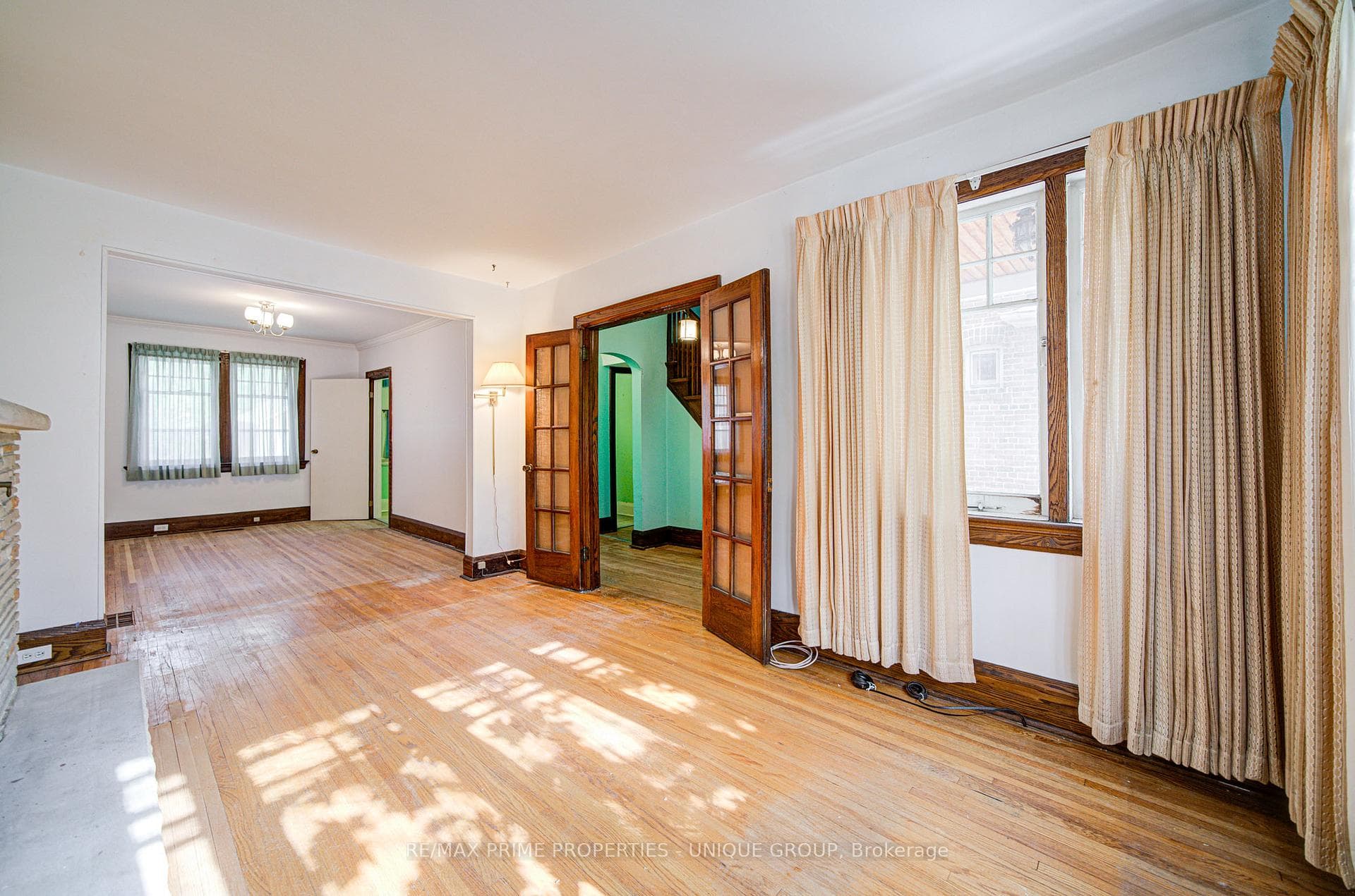 Living room with dining room in background.
