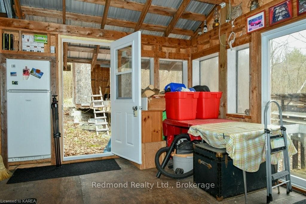 Door from sunroom to path to bathhouse & outhouse