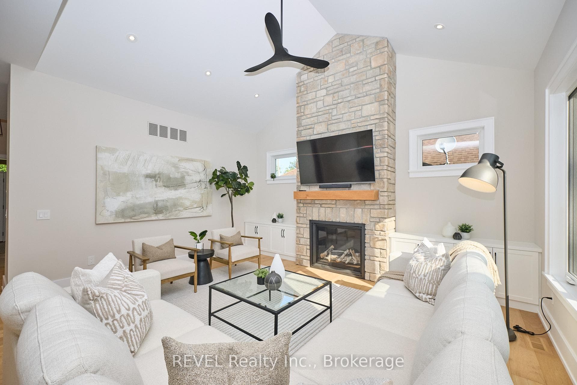 Floor to ceiling stone gas fireplace