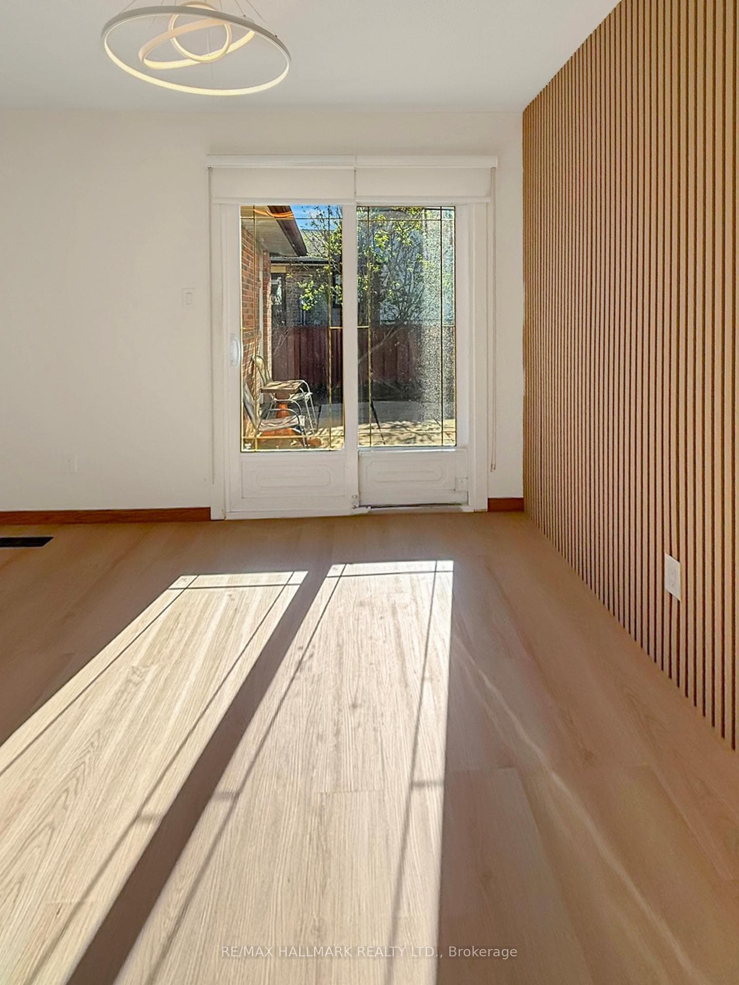 walkout to patio from Din. Feature wall