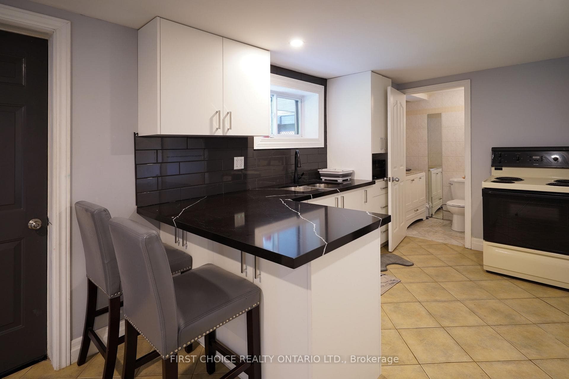 Lower kitchen. Heated floors, 3 piece bath.