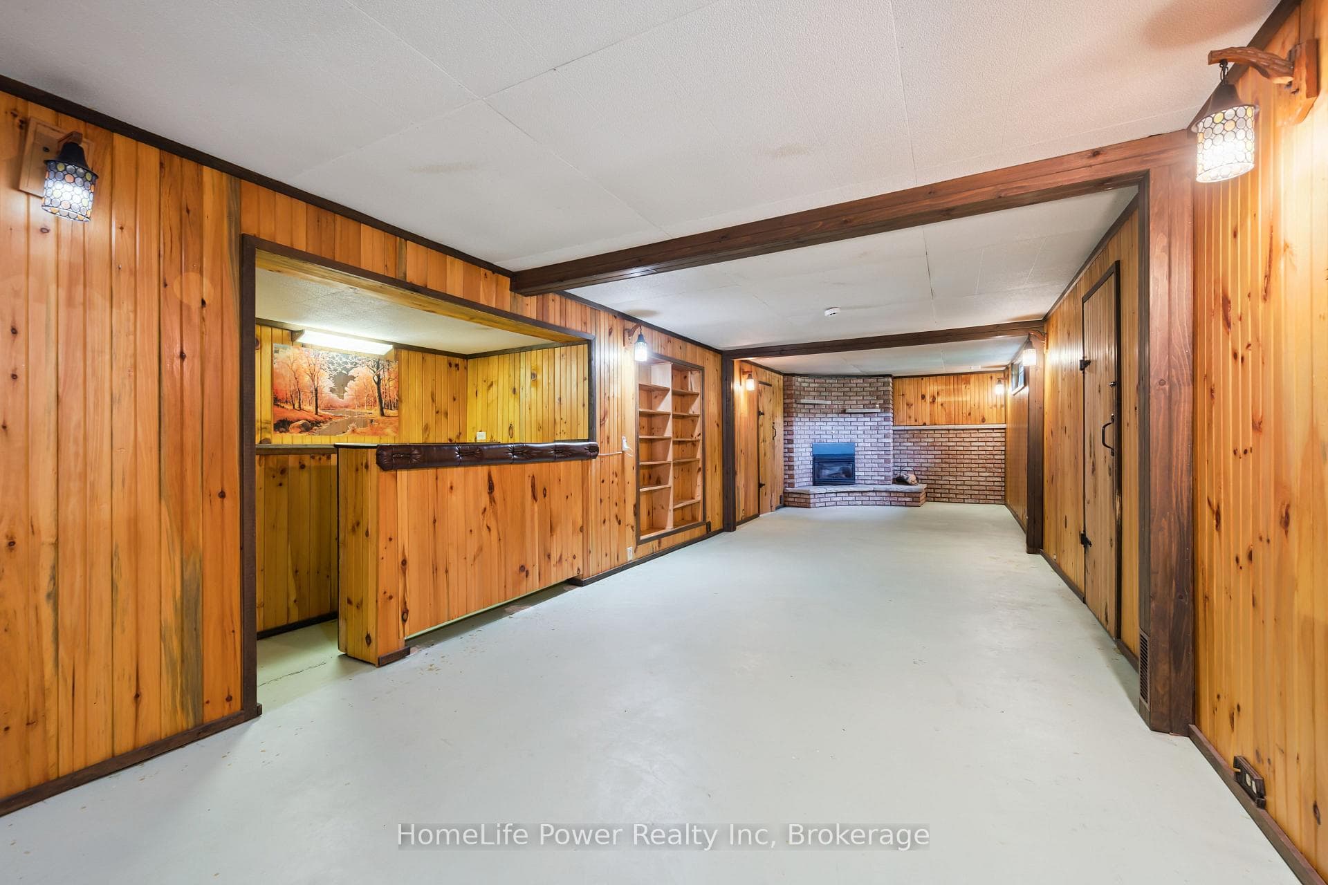 Rec room with bar and fireplace