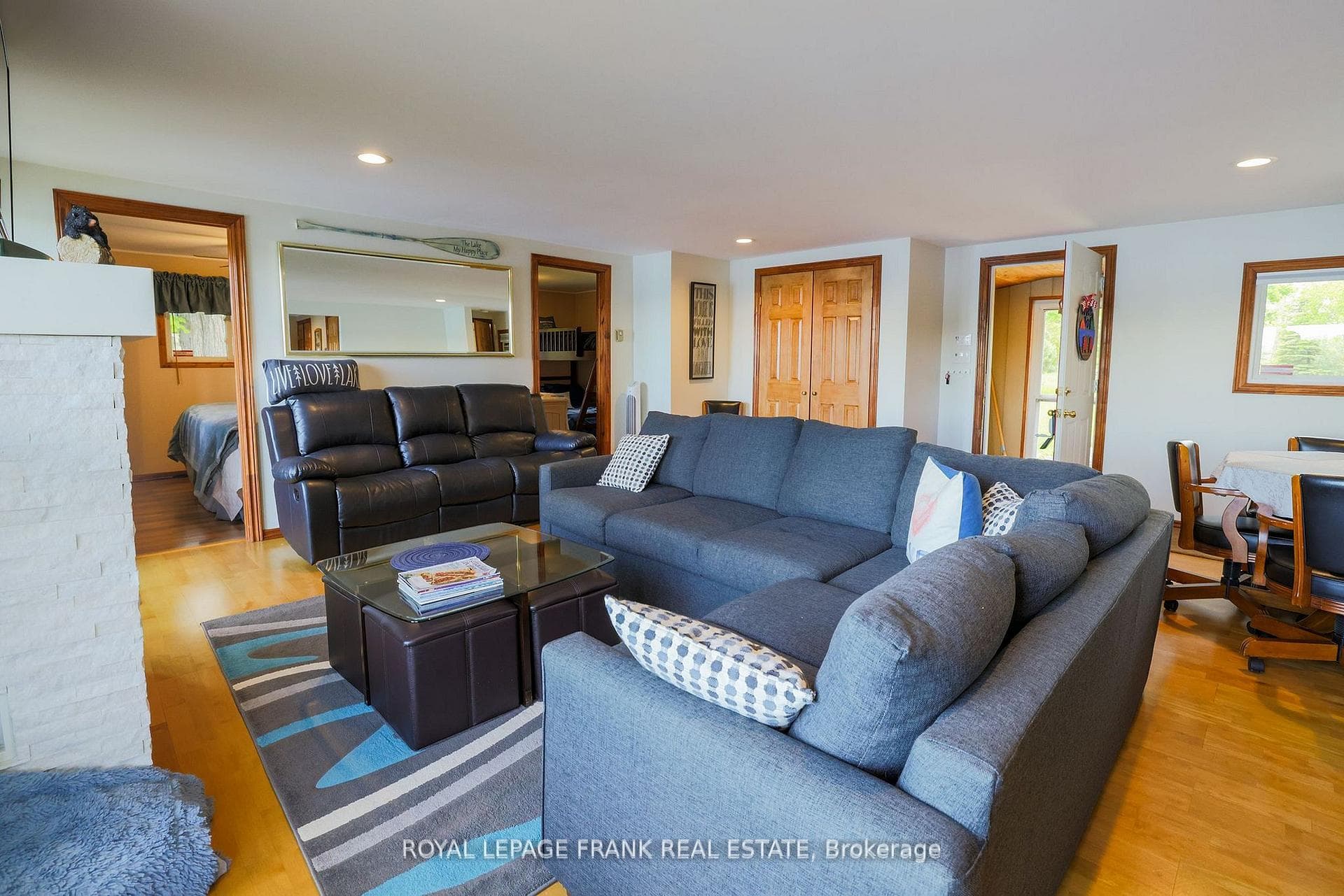 Living room with front door in the background.