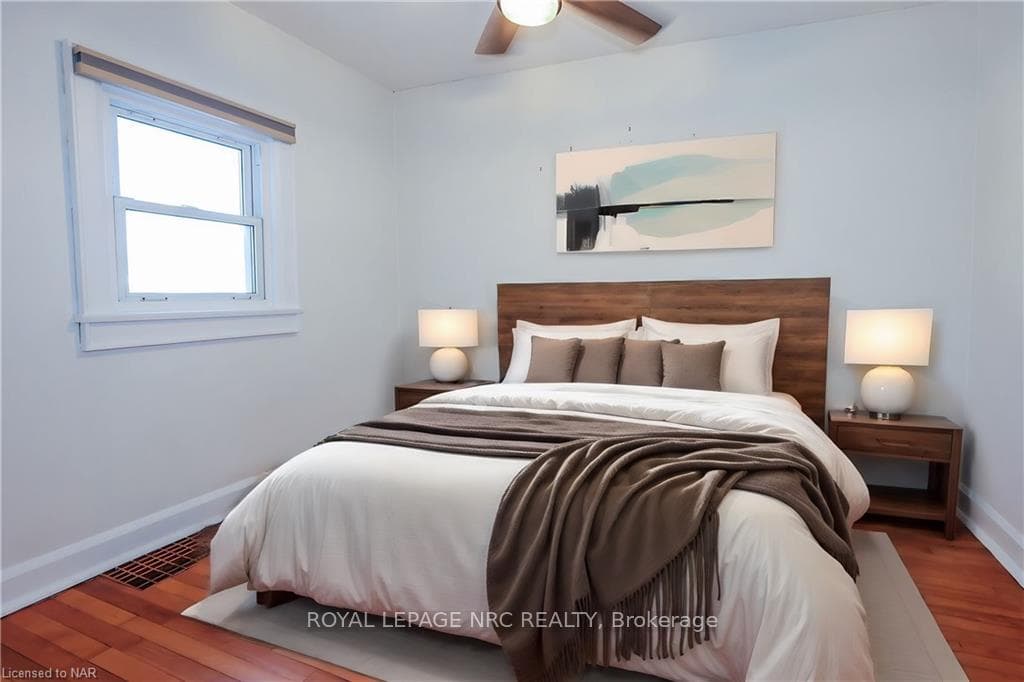 Primary bedroom with ceiling fan, fits a king size